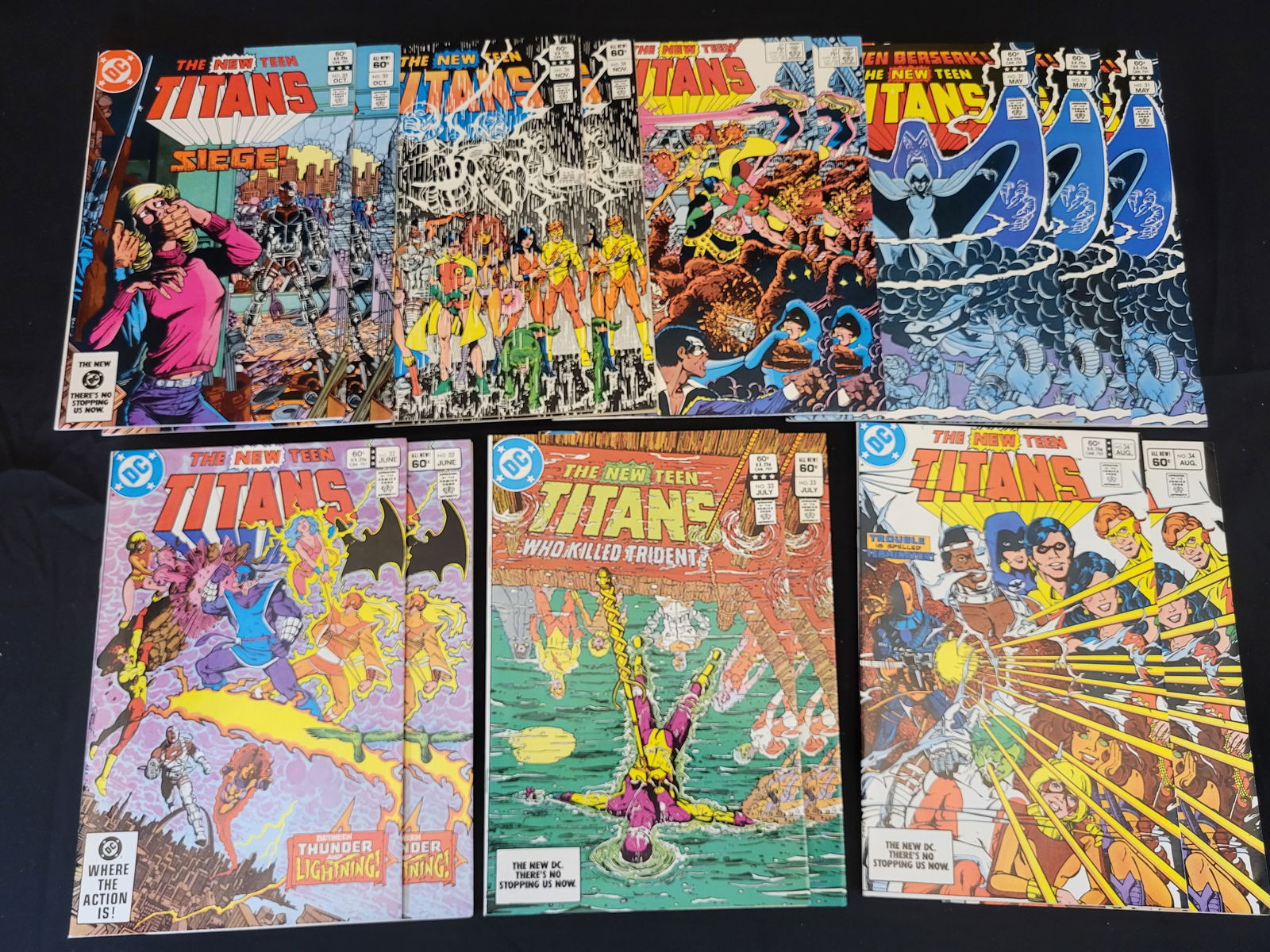 A Collection of The New Teen Titans Comic Books: BID PER WHAT YOU SEE IN THE PHOTO, NOT THE AI GENERATED TITLES AND DESCRIPTIONS! This collection consists of various issues of The New Teen Titans comic book series published by DC Comics in the early
