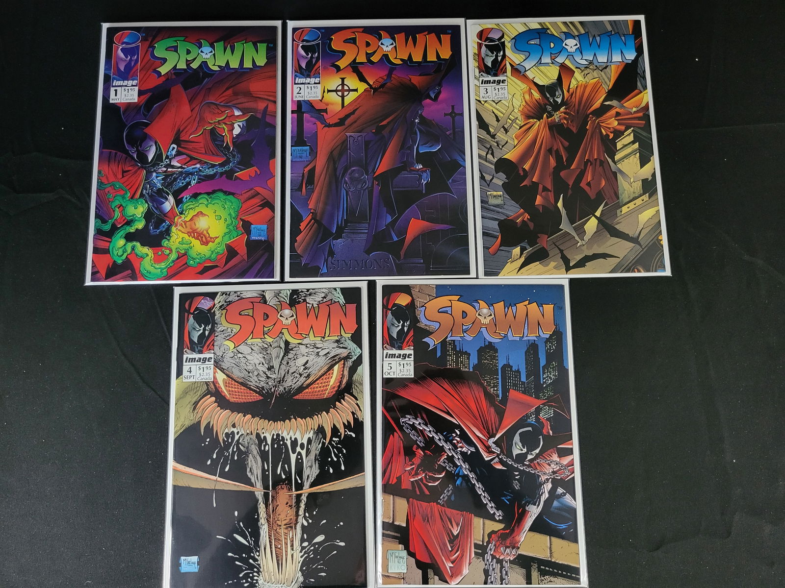 A Group of Spawn Comic Books by Todd McFarlane for Image Comics: BID PER WHAT YOU SEE IN THE PHOTO, NOT THE AI GENERATED TITLES AND DESCRIPTIONS! A group of Spawn comic books published by Image Comics in 1992, created by Todd McFarlane. The collection includes issu