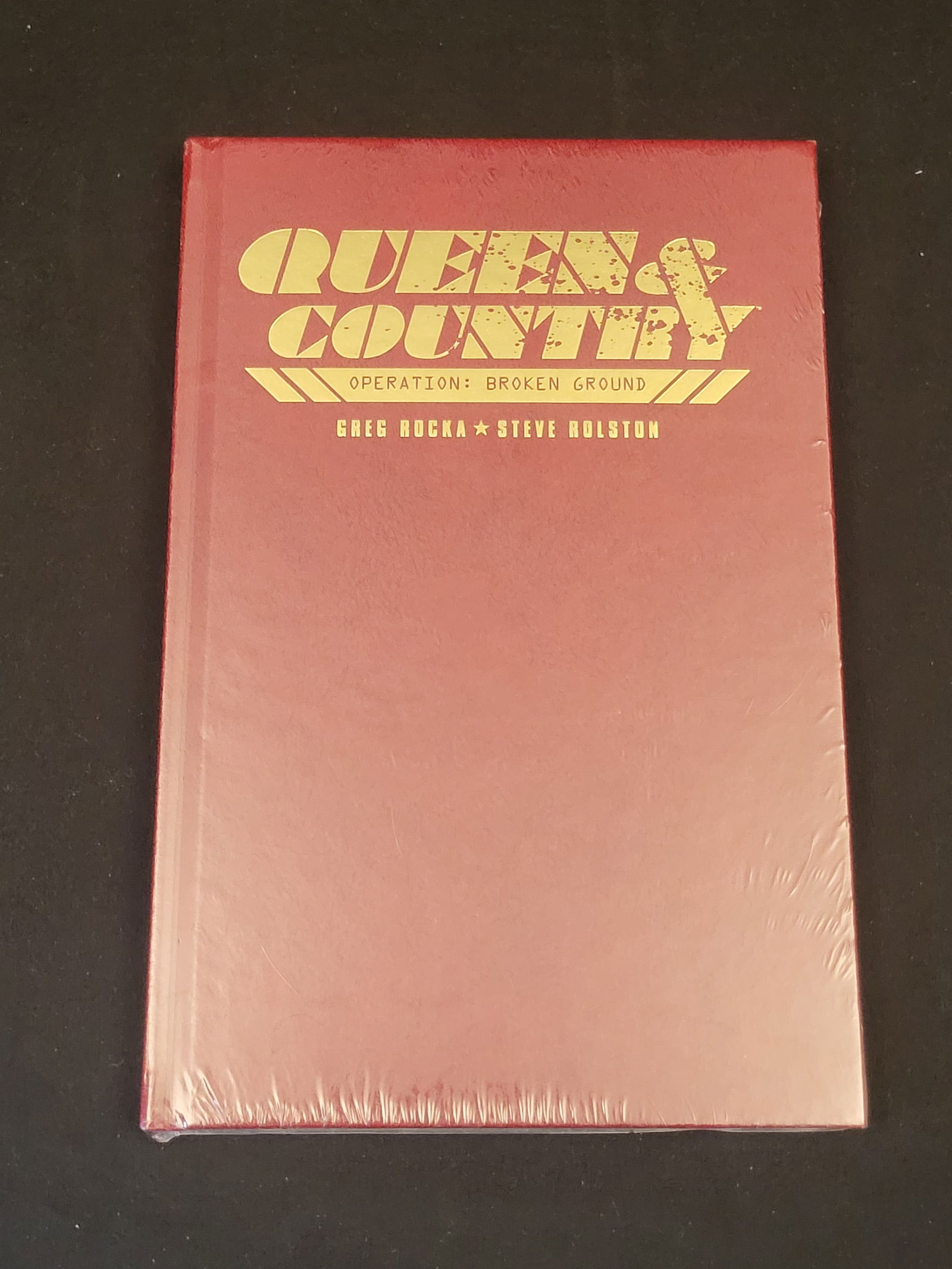 Queen & Country Operation Broken Ground Limited Edition Hardcover Greg Rucka Steve Rolston Oni Press: BID PER WHAT YOU SEE IN THE PHOTO, NOT THE AI GENERATED TITLES AND DESCRIPTIONS! A special edition hardcover copy of the graphic novel Queen & Country: Operation Broken Ground, written by Greg Rucka a