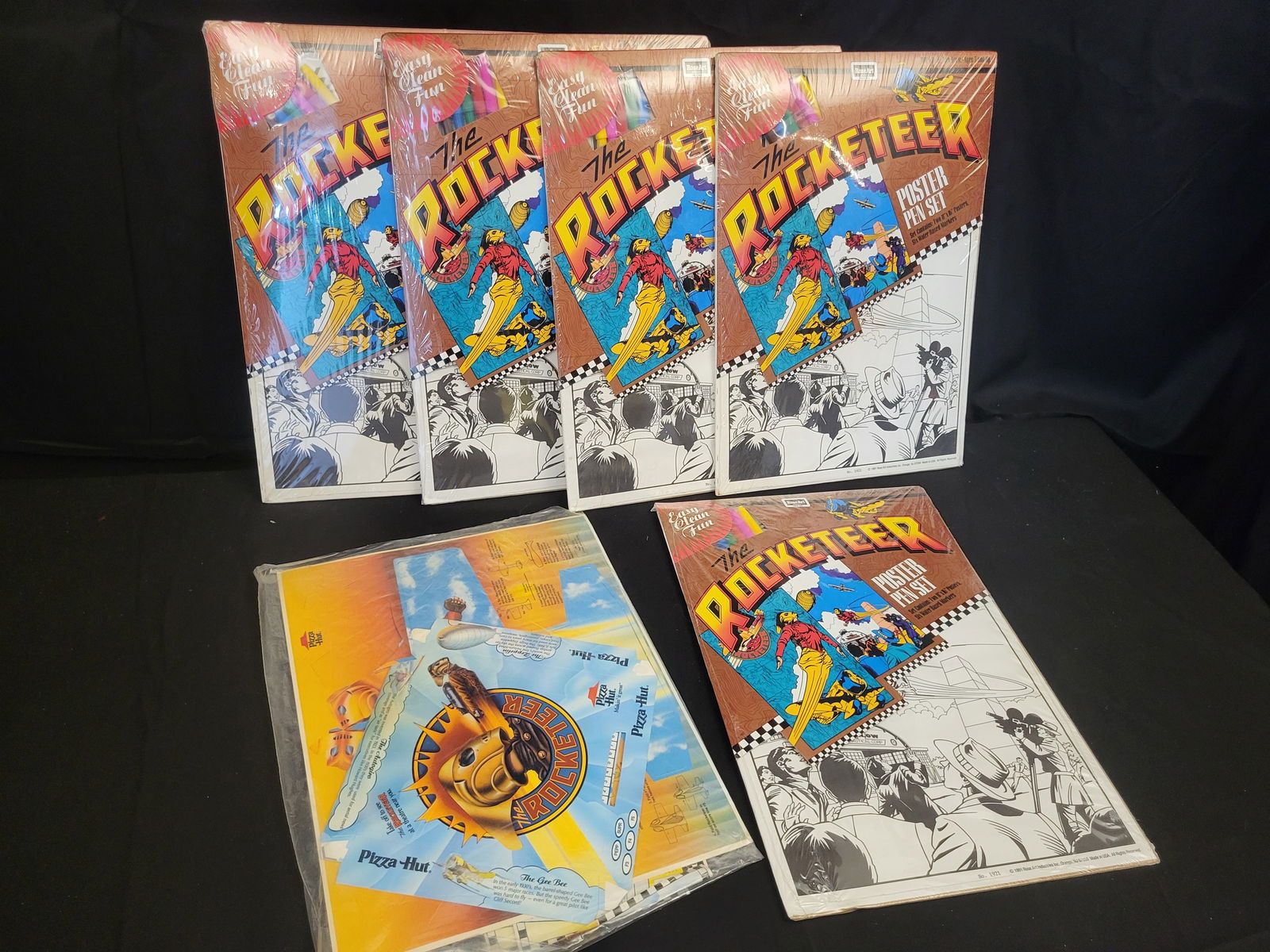 A Collection of Vintage Rose Art The Rocketeer Poster Pen Sets and Promotional Ephemera (1 of 4)