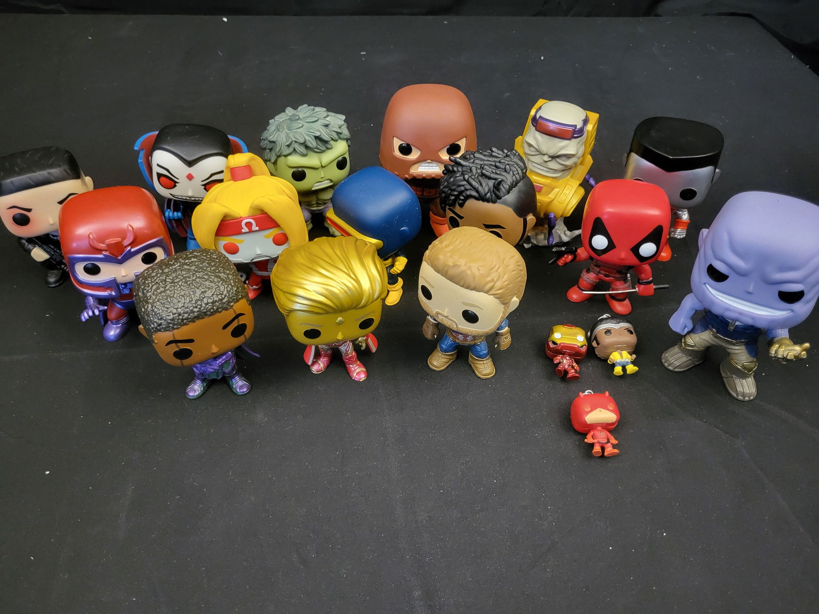 A Collection of Funko Marvel Pocket Pop! Advent Calendar Figures: BID PER WHAT YOU SEE IN THE PHOTO, NOT THE AI GENERATED TITLES AND DESCRIPTIONS! A collection of Funko Pocket Pop! vinyl figures featuring characters from the Marvel Universe, including those identifi