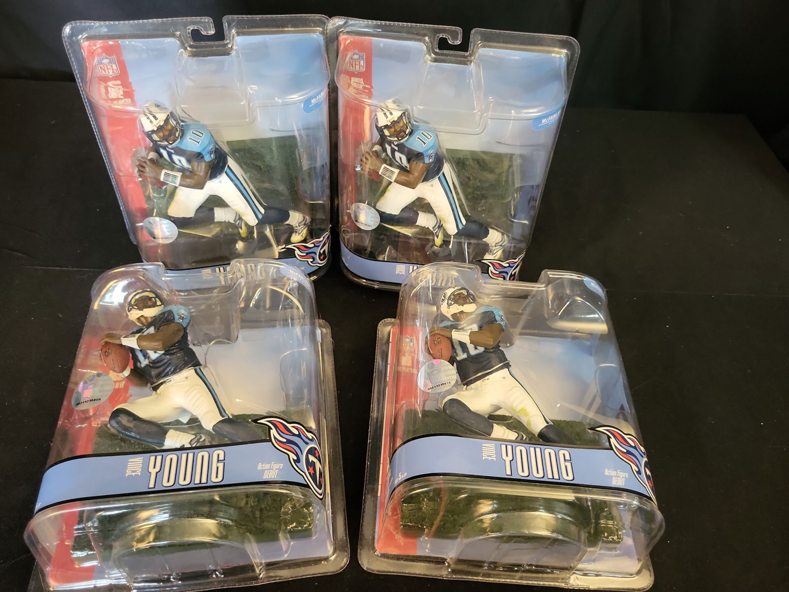 I00936 | Vince Young Tennessee Titans McFarlane Toys NFL Series 15 Action Figures, NFL Licensed: BID PER WHAT YOU SEE IN THE PHOTO, NOT THE AI GENERATED TITLES AND DESCRIPTIONS! Vince Young Tennessee Titans McFarlane Toys NFL Series 15 Action Figures, NFL LicensedA collection of four McFarlane To
