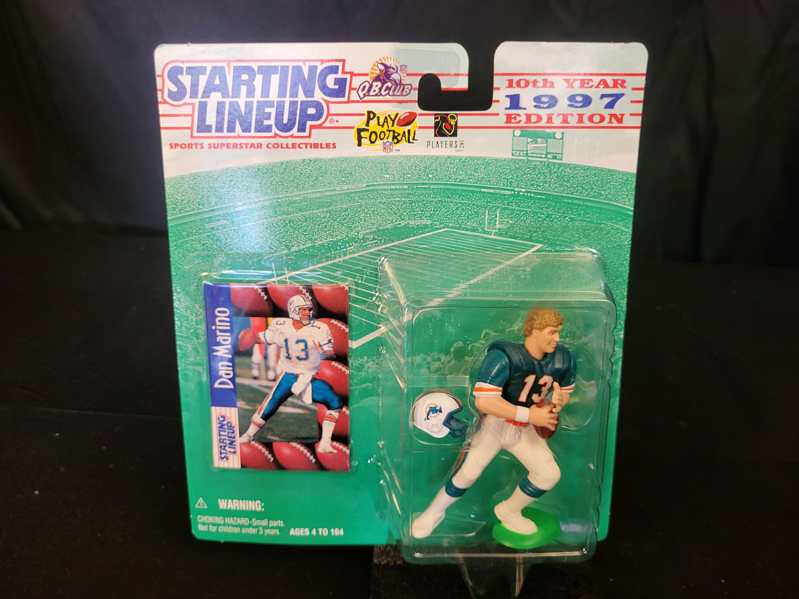 I00612 | 1997 Kenner Starting Lineup Dan Marino Miami Dolphins Action Figure: BID PER WHAT YOU SEE IN THE PHOTO, NOT THE AI GENERATED TITLES AND DESCRIPTIONS! 1997 Kenner Starting Lineup Dan Marino Miami Dolphins Action FigureThis 1997 edition Starting Lineup sports collectible