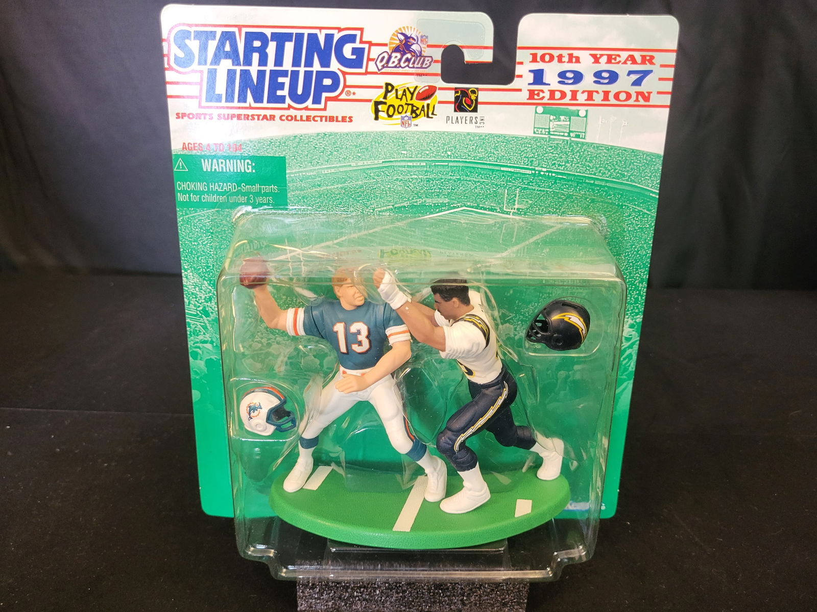 I00610 | A Kenner Starting Lineup 10th Year 1997 Edition Dan Marino Action Figure Set: BID PER WHAT YOU SEE IN THE PHOTO, NOT THE AI GENERATED TITLES AND DESCRIPTIONS! A Kenner Starting Lineup 10th Year 1997 Edition Dan Marino Action Figure Set This Kenner Starting Lineup 10th Year 1997
