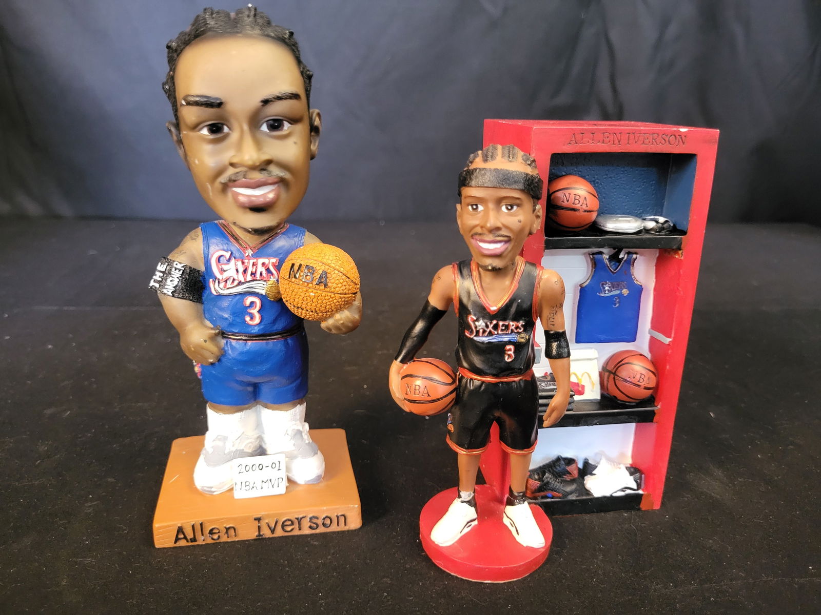I00636 | A Trio of Allen Iverson Philadelphia 76ers McDonald's Bobbleheads and Accessories: BID PER WHAT YOU SEE IN THE PHOTO, NOT THE AI GENERATED TITLES AND DESCRIPTIONS! A Trio of Allen Iverson Philadelphia 76ers McDonald's Bobbleheads and Accessories This lot features three items attribu