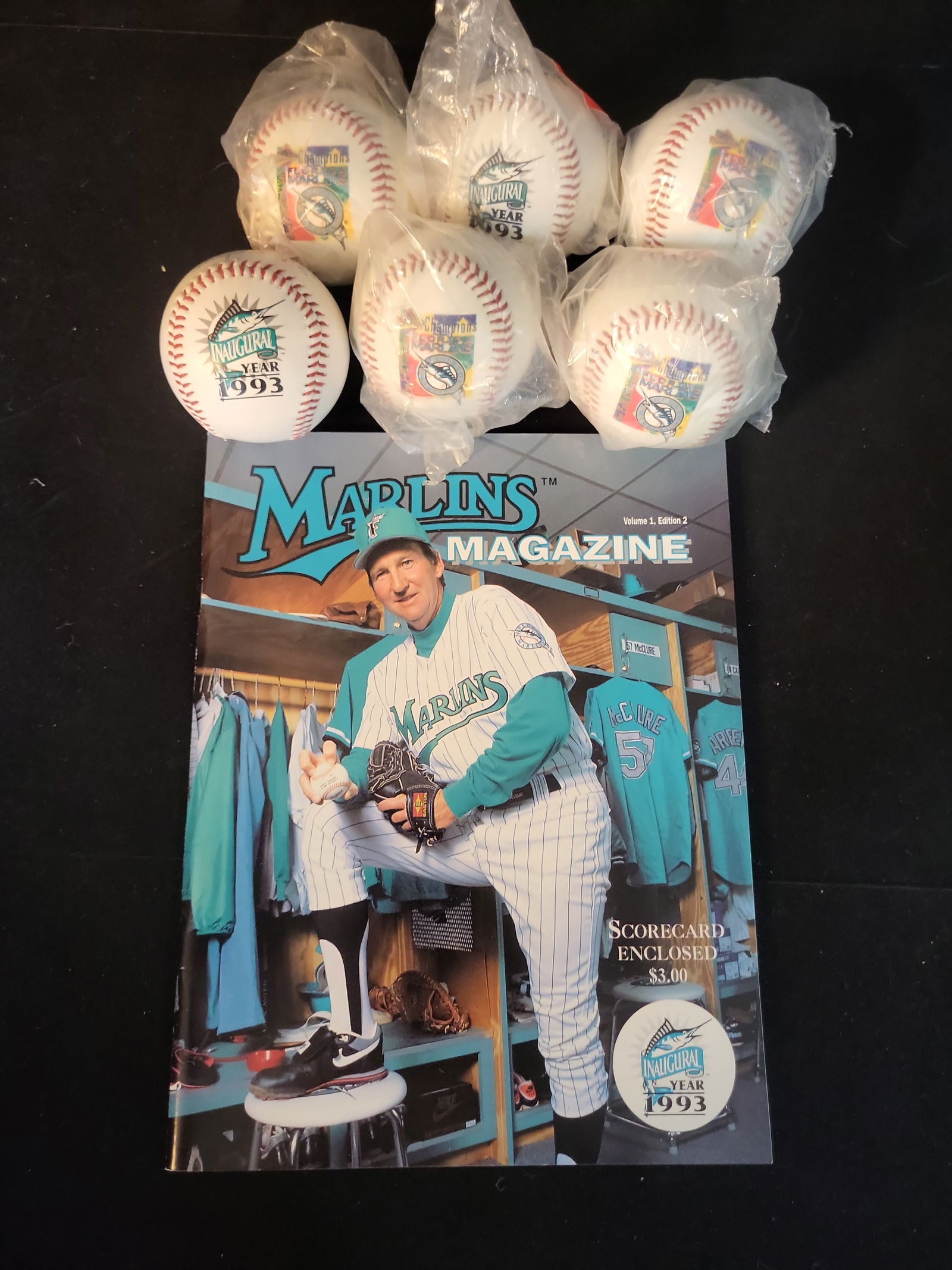 I01062 | Charlie Hough, Florida Marlins Commemorative Baseballs and 1993 Inaugural Magazine: BID PER WHAT YOU SEE IN THE PHOTO, NOT THE AI GENERATED TITLES AND DESCRIPTIONS! Charlie Hough, Florida Marlins Commemorative Baseballs and 1993 Inaugural Magazine This lot features a collection of co