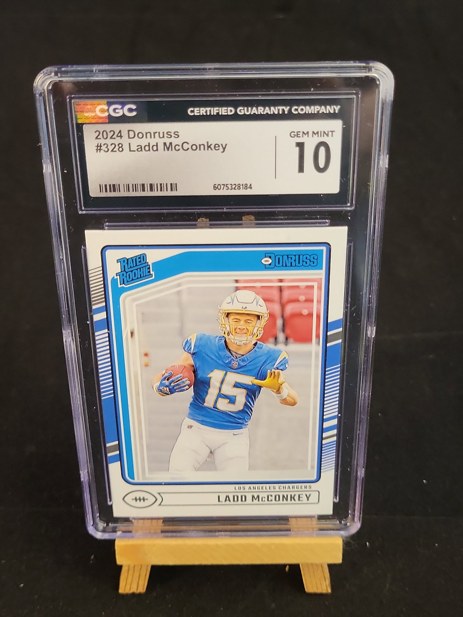 I00876 | Football 2024 Panini Donruss Ladd McConkey Rated Rookie #328 CGC 10 Gem Mint: BID PER WHAT YOU SEE IN THE PHOTO, NOT THE AI GENERATED TITLES AND DESCRIPTIONS! Football 2024 Panini Donruss Ladd McConkey Rated Rookie #328 CGC 10 Gem Mint This is a 2024 Panini Donruss football car