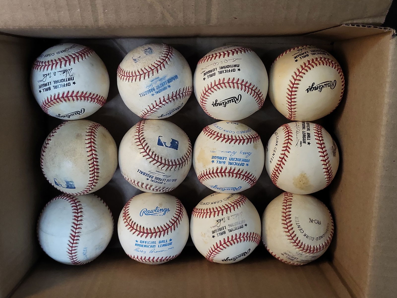 I00995 | Collection of 12 Rawlings Official American and National League Baseballs 1980s-1990s: BID PER WHAT YOU SEE IN THE PHOTO, NOT THE AI GENERATED TITLES AND DESCRIPTIONS! Collection of 12 Rawlings Official American and National League Baseballs 1980s-1990s This lot features a collection of