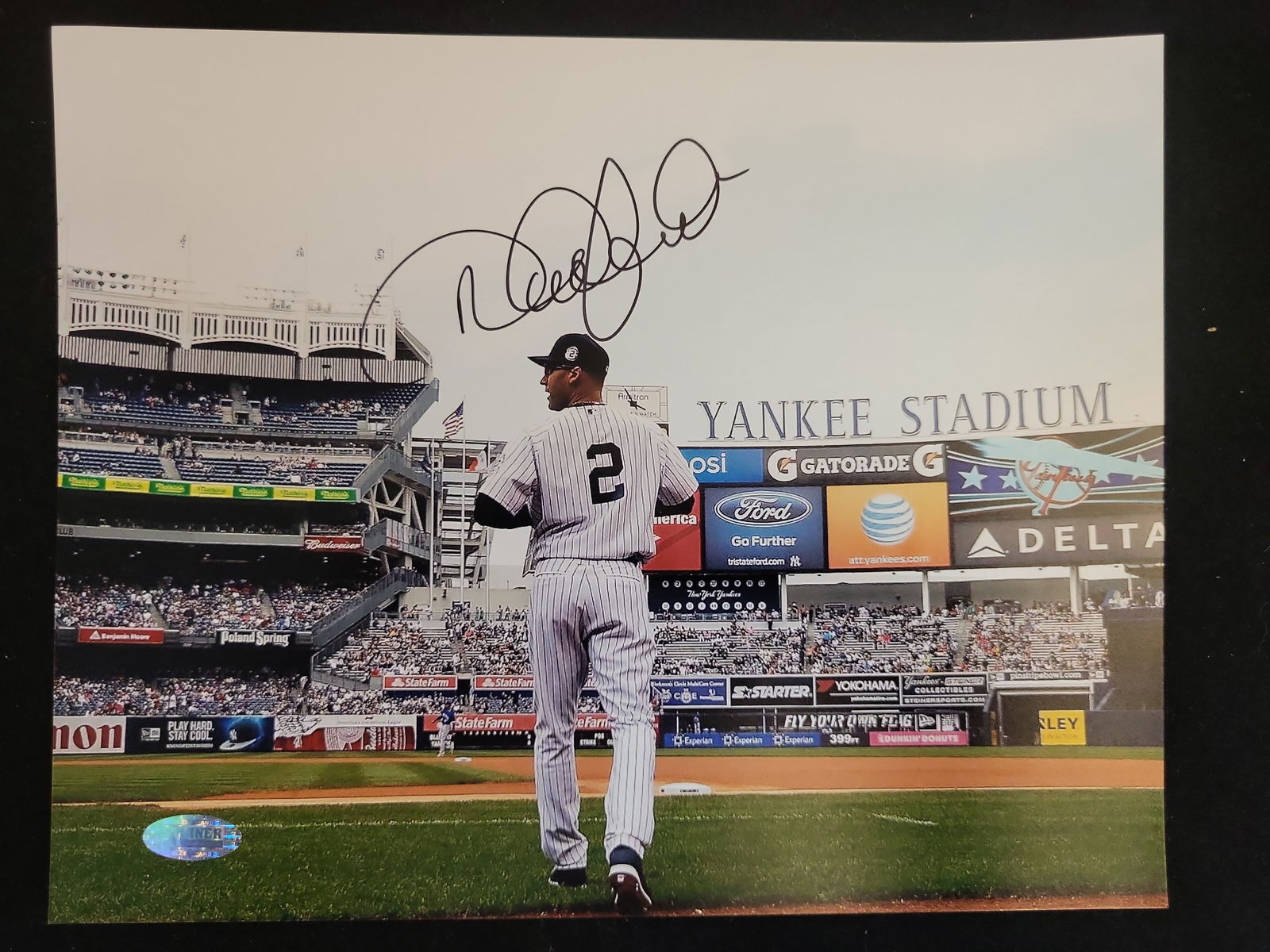 I01233 | Derek Jeter Signed New York Yankees Photograph, Steiner Sports Authenticated: BID PER WHAT YOU SEE IN THE PHOTO, NOT THE AI GENERATED TITLES AND DESCRIPTIONS! Derek Jeter Signed New York Yankees Photograph, Steiner Sports Authenticated This lot features a professional large-for