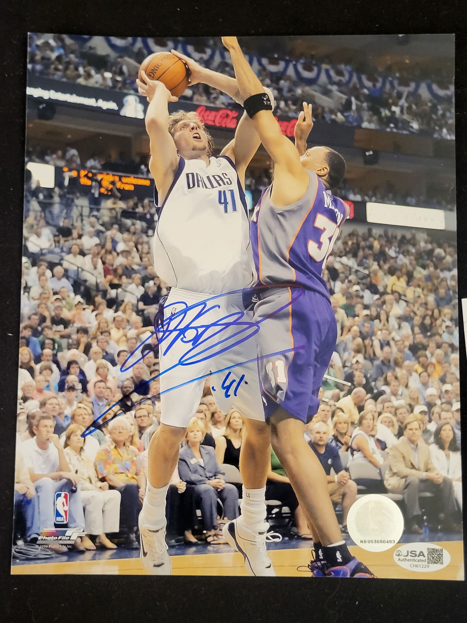 I00768 | Dirk Nowitzki Autographed Dallas Mavericks vs. Phoenix Suns 8x10 Photograph: BID PER WHAT YOU SEE IN THE PHOTO, NOT THE AI GENERATED TITLES AND DESCRIPTIONS! Dirk Nowitzki Autographed Dallas Mavericks vs. Phoenix Suns 8x10 PhotographThis autographed color action photograph fea