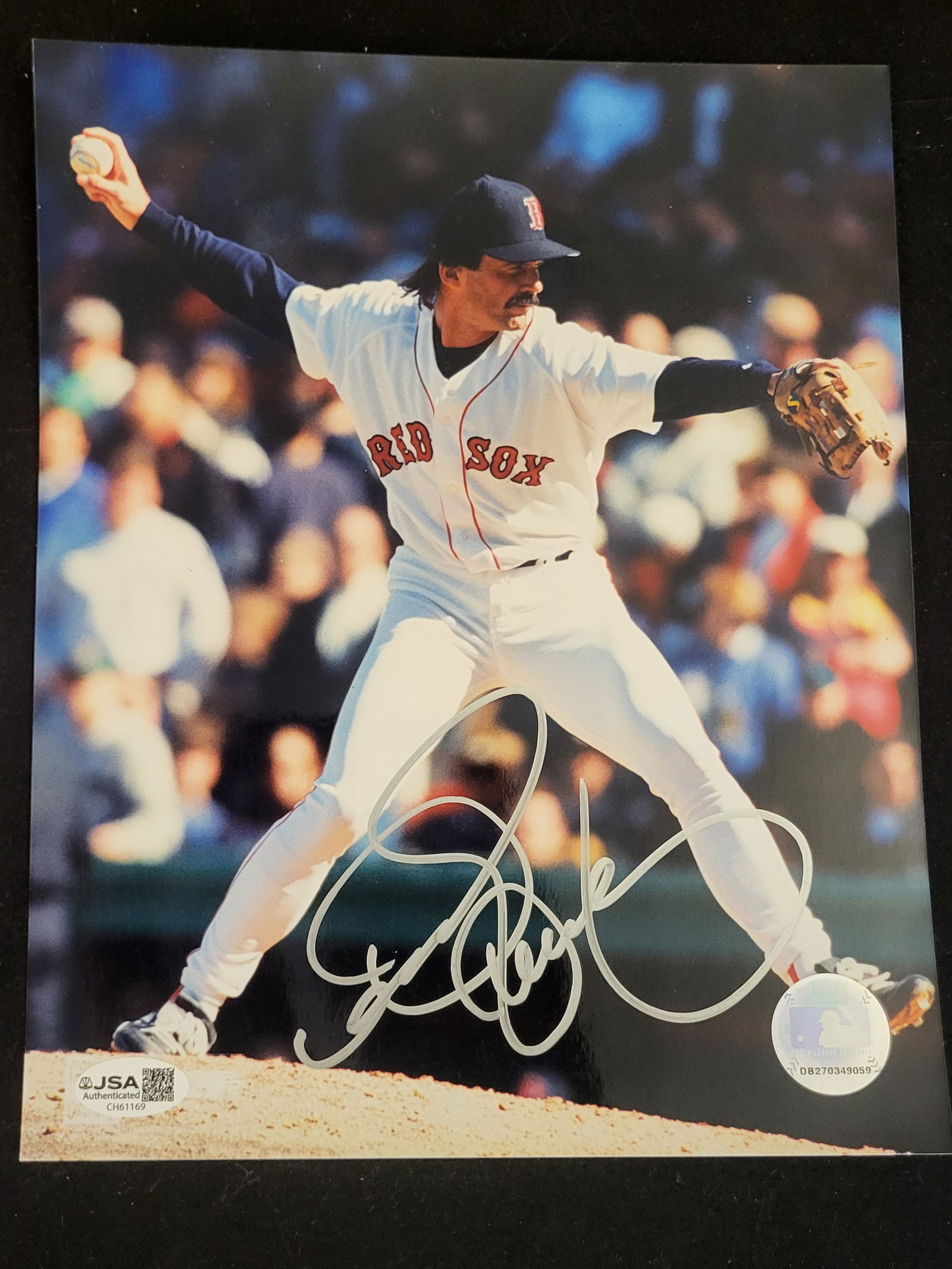 I00719 | Luis Tiant Boston Red Sox Signed Pitching Photograph: BID PER WHAT YOU SEE IN THE PHOTO, NOT THE AI GENERATED TITLES AND DESCRIPTIONS! Luis Tiant Boston Red Sox Signed Pitching PhotographA signed color action photograph featuring professional baseball pl