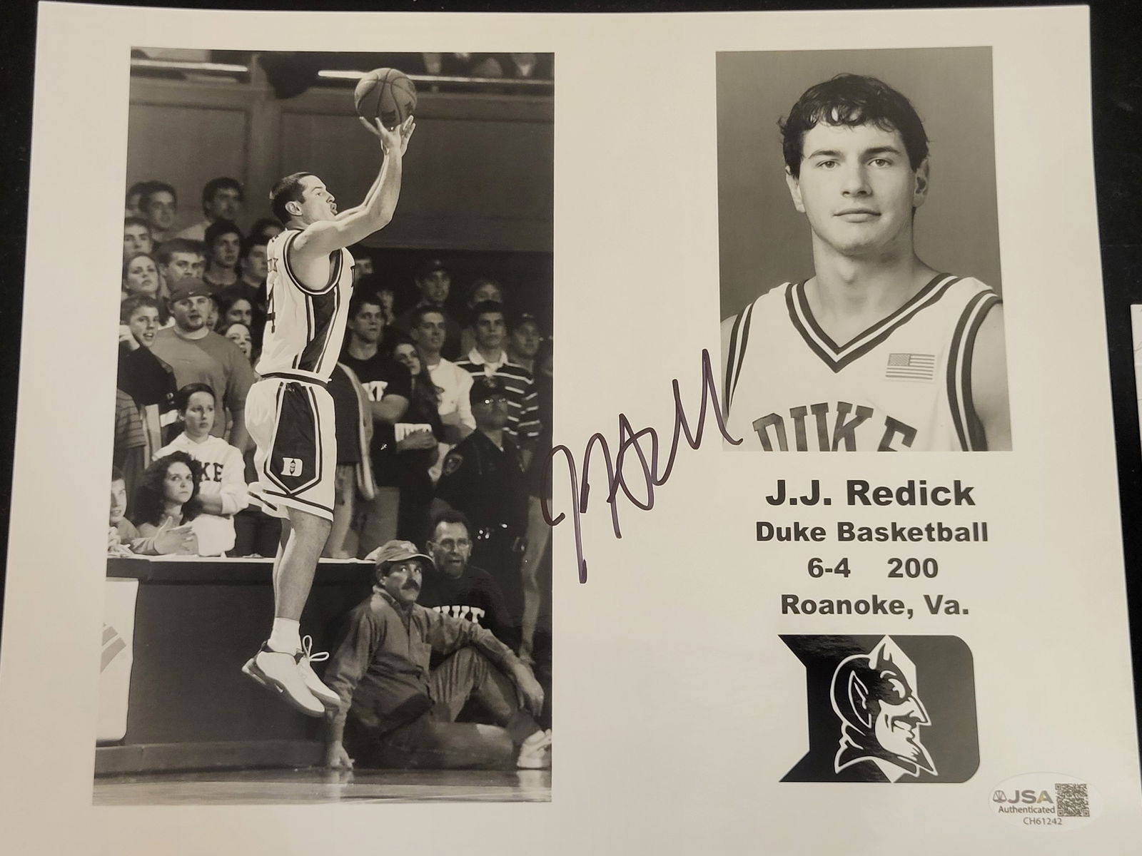 I00746 | J.J. Redick Autographed Duke Blue Devils Composite JSA: BID PER WHAT YOU SEE IN THE PHOTO, NOT THE AI GENERATED TITLES AND DESCRIPTIONS! J.J. Redick Autographed Duke Blue Devils Composite JSA A black-and-white composite photograph featuring basketball play
