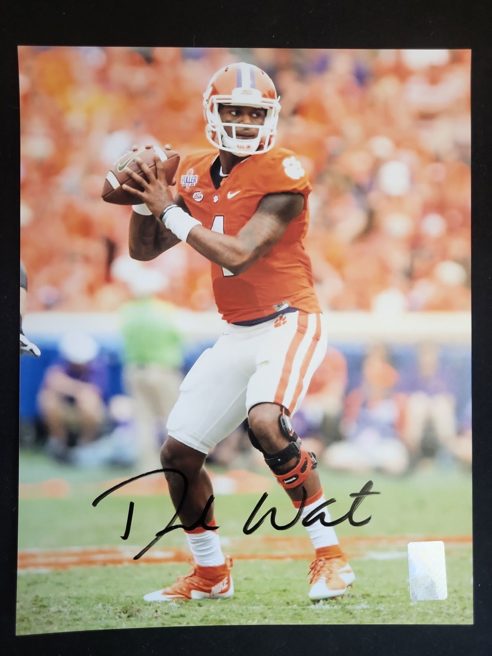 I01231 | Deshaun Watson Signed Clemson Tigers Action Photograph, Authenticated: BID PER WHAT YOU SEE IN THE PHOTO, NOT THE AI GENERATED TITLES AND DESCRIPTIONS! Deshaun Watson Signed Clemson Tigers Action Photograph, AuthenticatedThis professional auction lot features a high-glos
