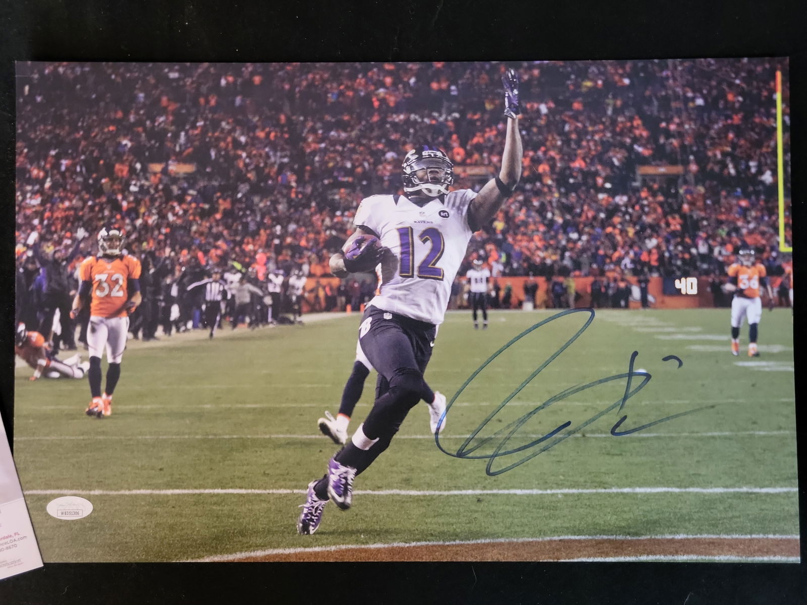 I00973 | Jacoby Jones Autographed 8x10 Baltimore Ravens Action Photograph, JSA Authenticated: BID PER WHAT YOU SEE IN THE PHOTO, NOT THE AI GENERATED TITLES AND DESCRIPTIONS! Jacoby Jones Autographed 8x10 Baltimore Ravens Action Photograph, JSA AuthenticatedThis professional 8x10 action photog