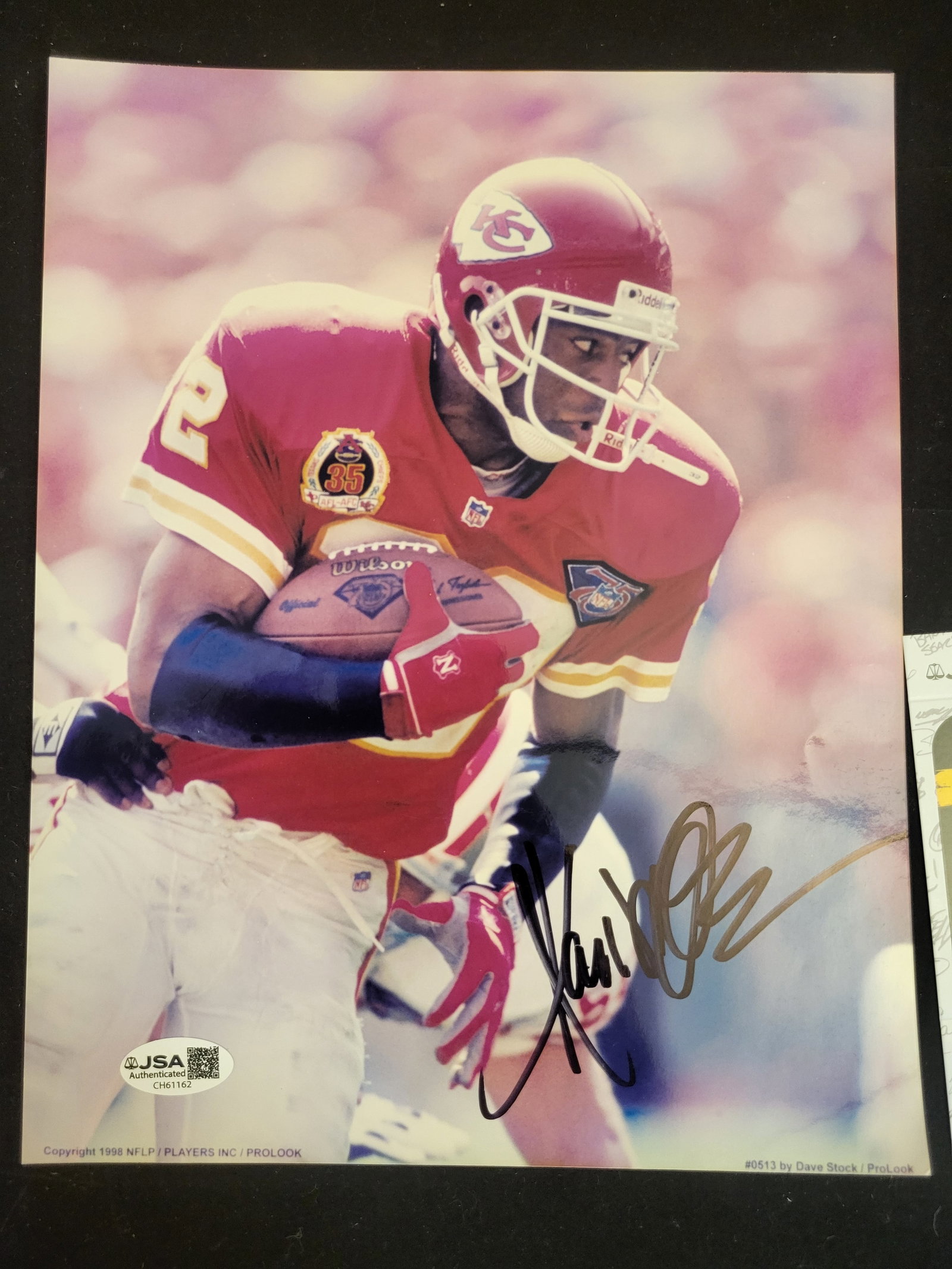 I00706 | Marcus Allen Signed Kansas City Chiefs 8x10 JSA Authenticated: BID PER WHAT YOU SEE IN THE PHOTO, NOT THE AI GENERATED TITLES AND DESCRIPTIONS! Marcus Allen Signed Kansas City Chiefs 8x10 JSA Authenticated This lot features an autographed color photograph of Marc