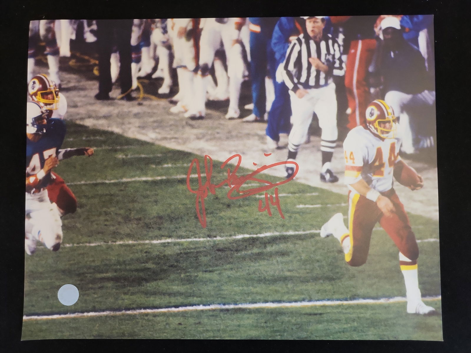 I01242 | John Riggins Autographed Washington Redskins 8x10 Action Photograph, Schwartz Sports: BID PER WHAT YOU SEE IN THE PHOTO, NOT THE AI GENERATED TITLES AND DESCRIPTIONS! John Riggins Autographed Washington Redskins 8x10 Action Photograph, Schwartz Sports AuthenticatedThis professional 8x1