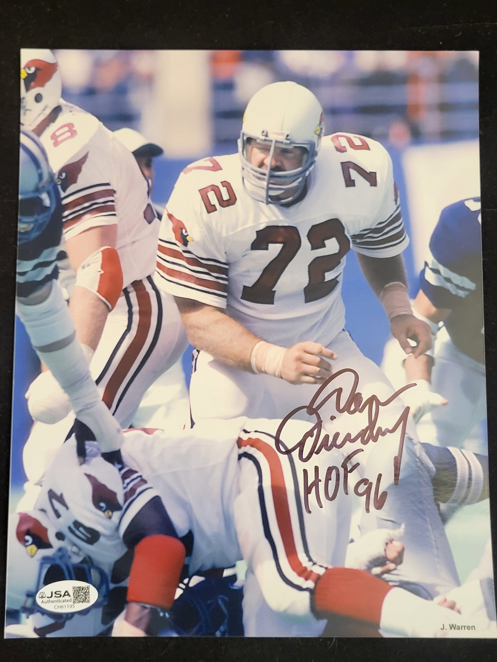 I00772 | Dan Dierdorf Autographed Photograph with HOF 96 Inscription JSA: BID PER WHAT YOU SEE IN THE PHOTO, NOT THE AI GENERATED TITLES AND DESCRIPTIONS! Dan Dierdorf Autographed Photograph with HOF 96 Inscription JSA A color photograph depicting Pro Football Hall of Fame 