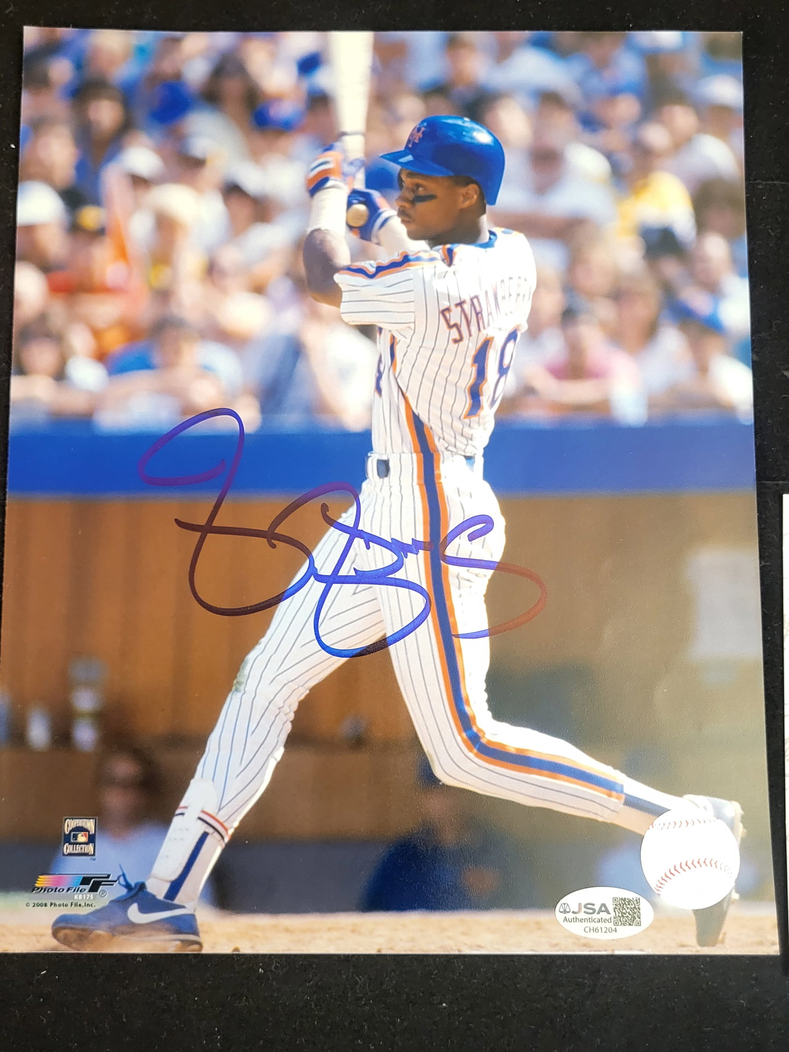 I00782 | Darryl Strawberry Signed New York Mets 8x10 JSA: BID PER WHAT YOU SEE IN THE PHOTO, NOT THE AI GENERATED TITLES AND DESCRIPTIONS! Darryl Strawberry Signed New York Mets 8x10 JSA A color photograph of Darryl Strawberry in a New York Mets pinstripe un