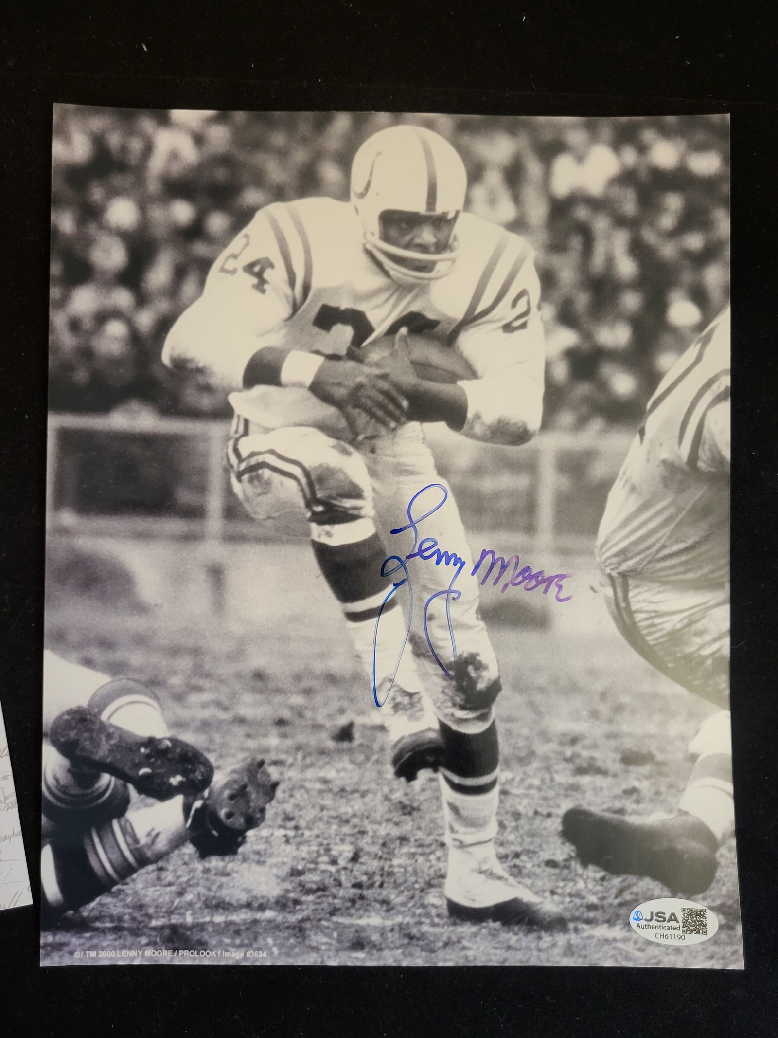 I00711 | Lenny Moore Baltimore Colts Autographed Photo with JSA Authentication: BID PER WHAT YOU SEE IN THE PHOTO, NOT THE AI GENERATED TITLES AND DESCRIPTIONS! Lenny Moore Baltimore Colts Autographed Photo with JSA AuthenticationA signed black and white action photograph of NFL