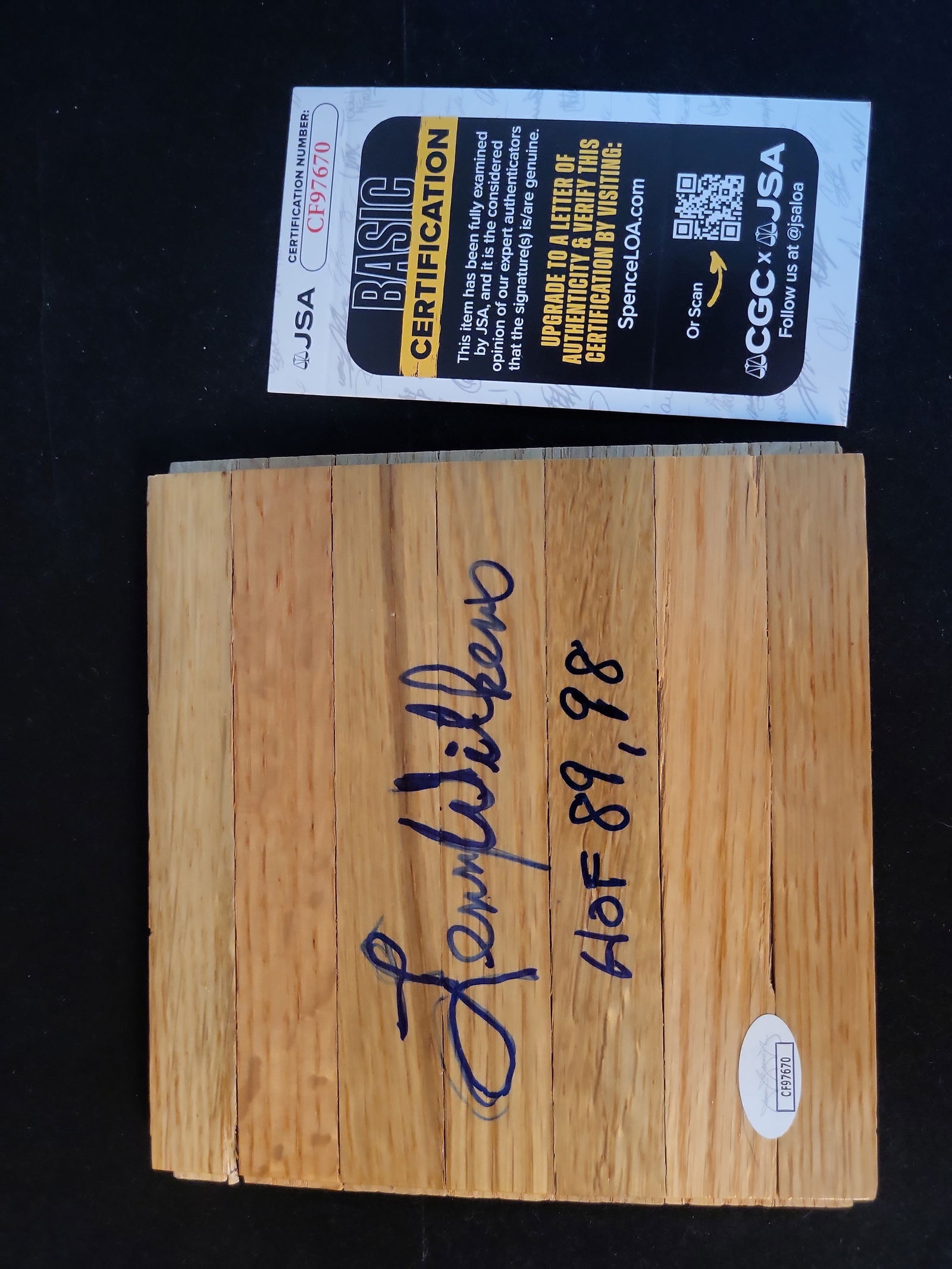 I01075 | Lenny Wilkens Autographed Basketball Court Floor Piece, JSA Authenticated: BID PER WHAT YOU SEE IN THE PHOTO, NOT THE AI GENERATED TITLES AND DESCRIPTIONS! Lenny Wilkens Autographed Basketball Court Floor Piece, JSA Authenticated This unique piece of sports memorabilia featu