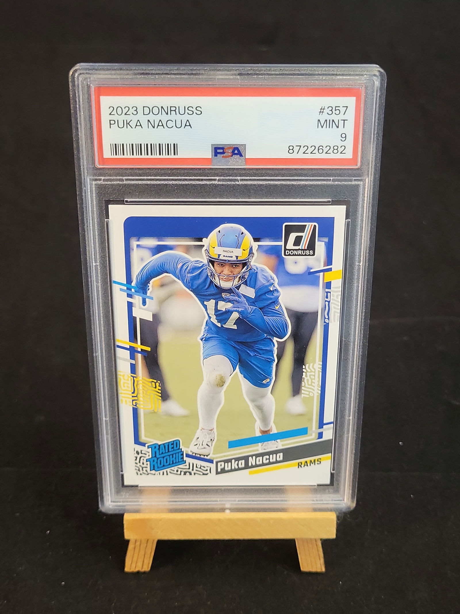 I00874 | NFL Puka Nacua 2023 Panini Donruss Rated Rookie #357 PSA 9: BID PER WHAT YOU SEE IN THE PHOTO, NOT THE AI GENERATED TITLES AND DESCRIPTIONS! NFL Puka Nacua 2023 Panini Donruss Rated Rookie #357 PSA 9 This is a professionally graded 2023 Panini Donruss Football
