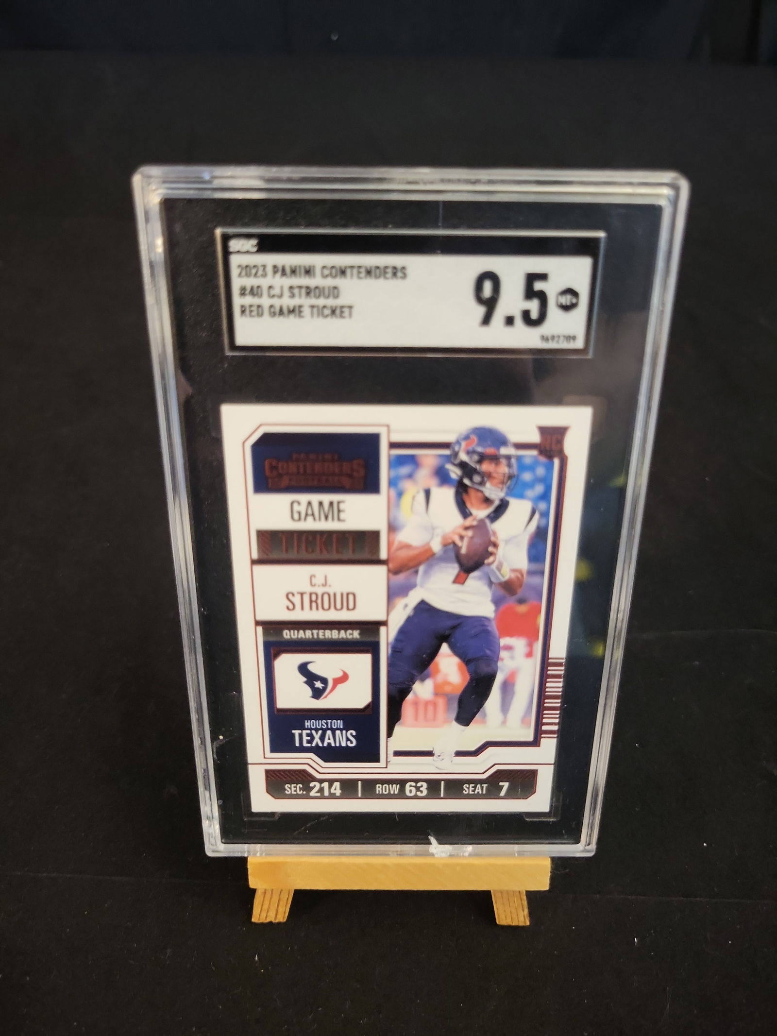 I00859 | 2023 Panini Contenders C.J. Stroud Red Game Ticket Rookie Card SGC 9.5 Mint+: BID PER WHAT YOU SEE IN THE PHOTO, NOT THE AI GENERATED TITLES AND DESCRIPTIONS! 2023 Panini Contenders C.J. Stroud Red Game Ticket Rookie Card SGC 9.5 Mint+ Brand: Panini. Year: 2023. Set: Contenders