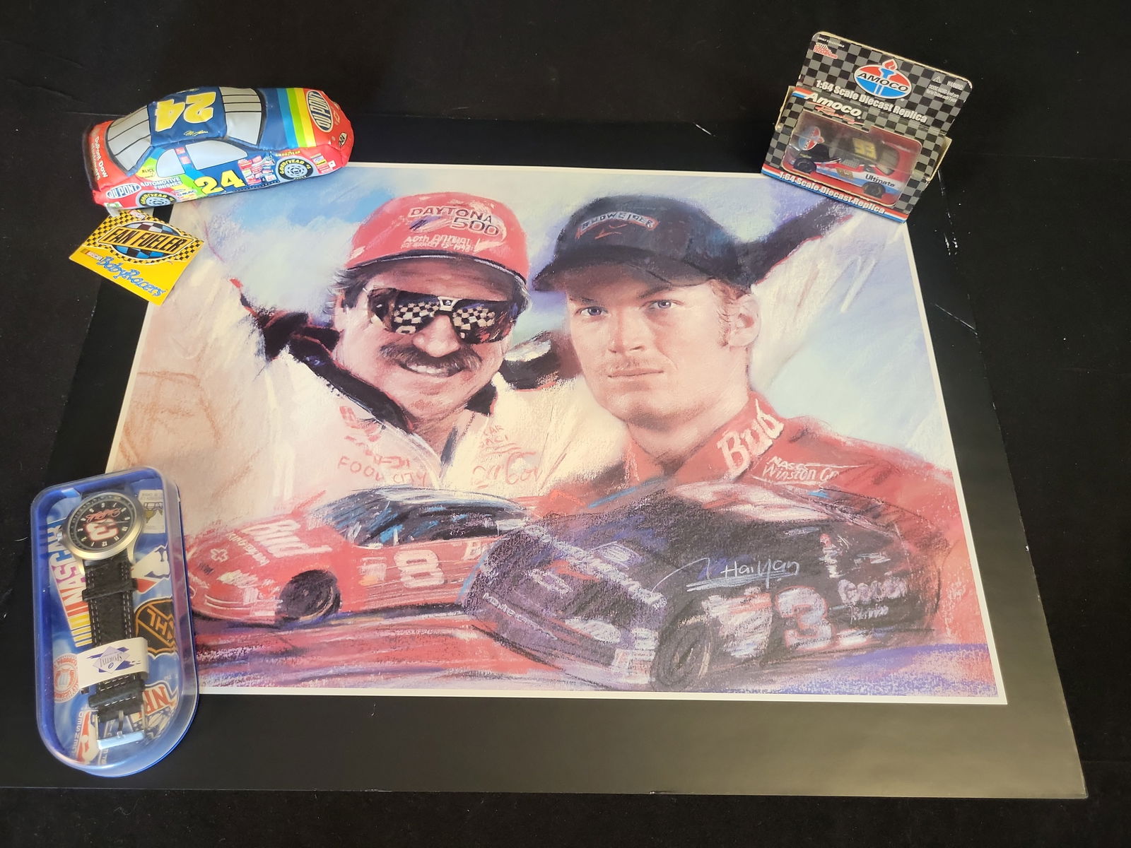 I00932 | Dale Earnhardt Sr. and Jr. NASCAR Memorabilia Collection, Unauthenticated: BID PER WHAT YOU SEE IN THE PHOTO, NOT THE AI GENERATED TITLES AND DESCRIPTIONS! Dale Earnhardt Sr. and Jr. NASCAR Memorabilia Collection, Unauthenticated This lot contains a collection of professiona