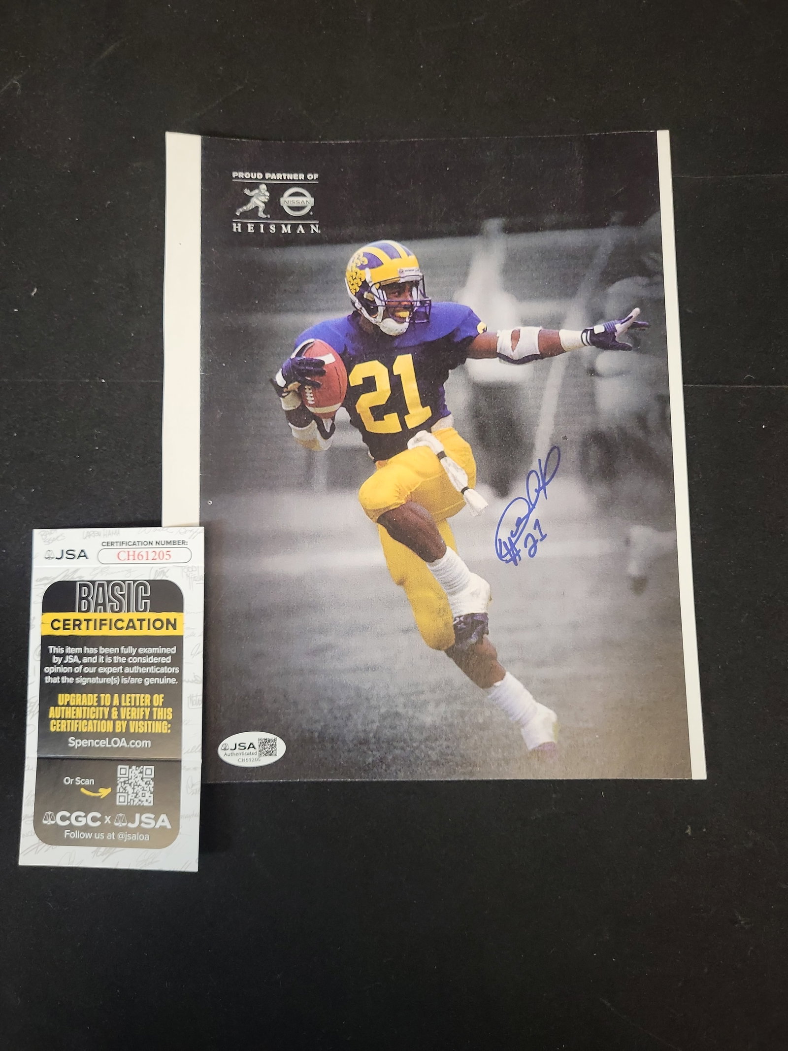 I01433 | Desmond Howard Signed University of Michigan Wolverines Photograph with JSA Authentication: BID PER WHAT YOU SEE IN THE PHOTO, NOT THE AI GENERATED TITLES AND DESCRIPTIONS! Desmond Howard Signed University of Michigan Wolverines Photograph with JSA Authentication This is an autographed color