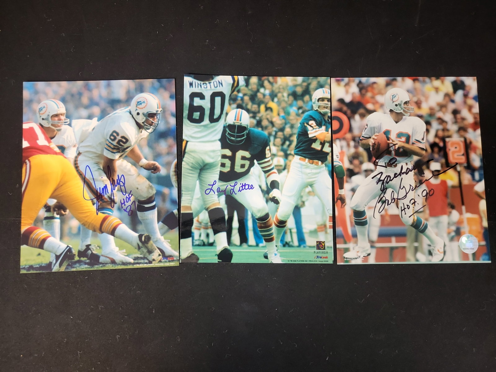 I01491 | Trio of Autographed Miami Dolphins Hall of Fame 8x10 Photographs: BID PER WHAT YOU SEE IN THE PHOTO, NOT THE AI GENERATED TITLES AND DESCRIPTIONS! Trio of Autographed Miami Dolphins Hall of Fame 8x10 Photographs This collection consists of three color 8x10 inch phot