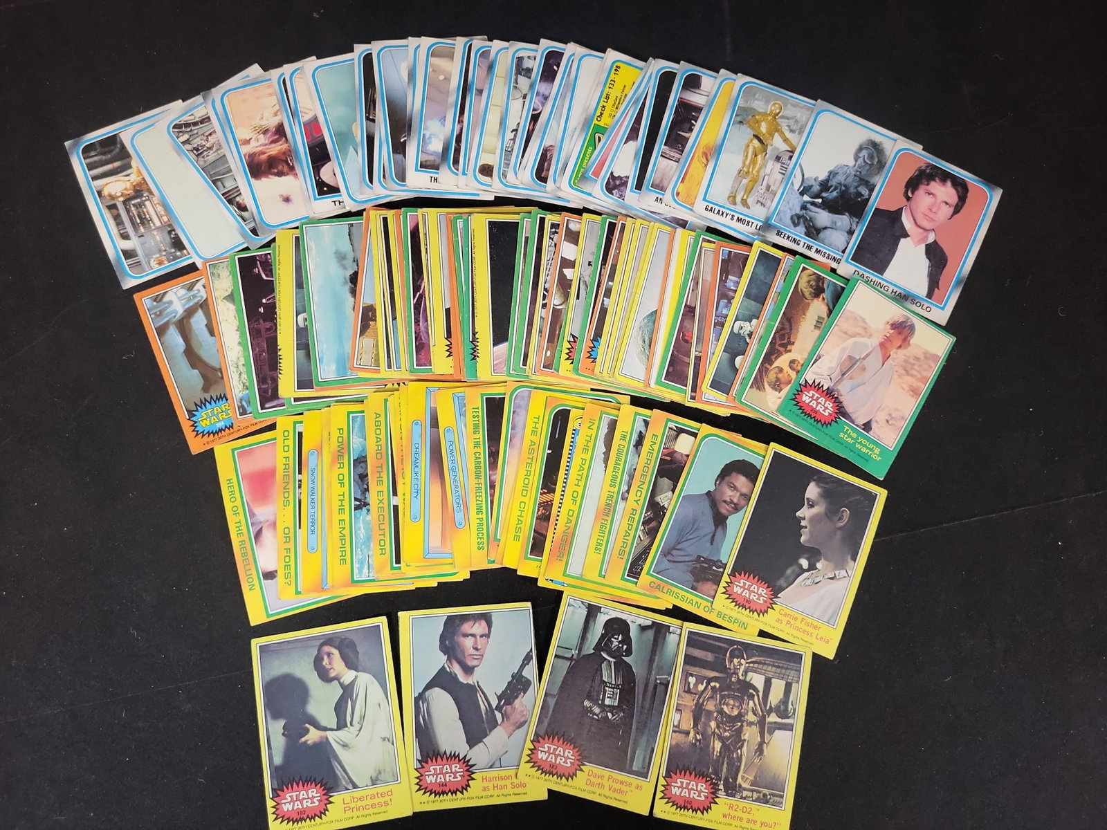 I01657 | A Collection of Vintage Topps Star Wars and The Empire Strikes Back Trading Cards: BID PER WHAT YOU SEE IN THE PHOTO, NOT THE AI GENERATED TITLES AND DESCRIPTIONS! A Collection of Vintage Topps Star Wars and The Empire Strikes Back Trading Cards A collection of approximately 60Ã