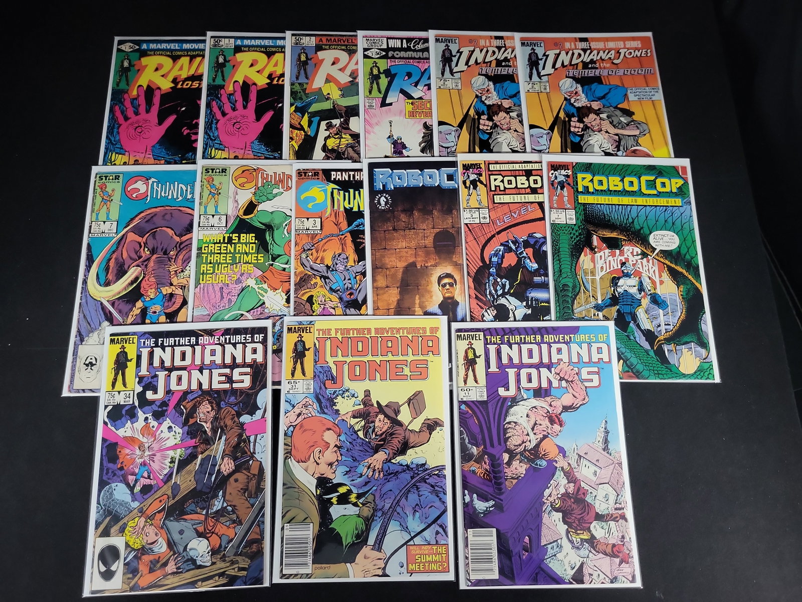 I02099 | A Collection of 15 Marvel and Dark Horse Comics Featuring Indiana Jones, Thundercats, and: BID PER WHAT YOU SEE IN THE PHOTO, NOT THE AI GENERATED TITLES AND DESCRIPTIONS! A Collection of 15 Marvel and Dark Horse Comics Featuring Indiana Jones, Thundercats, and RoboCop This lot consists of 