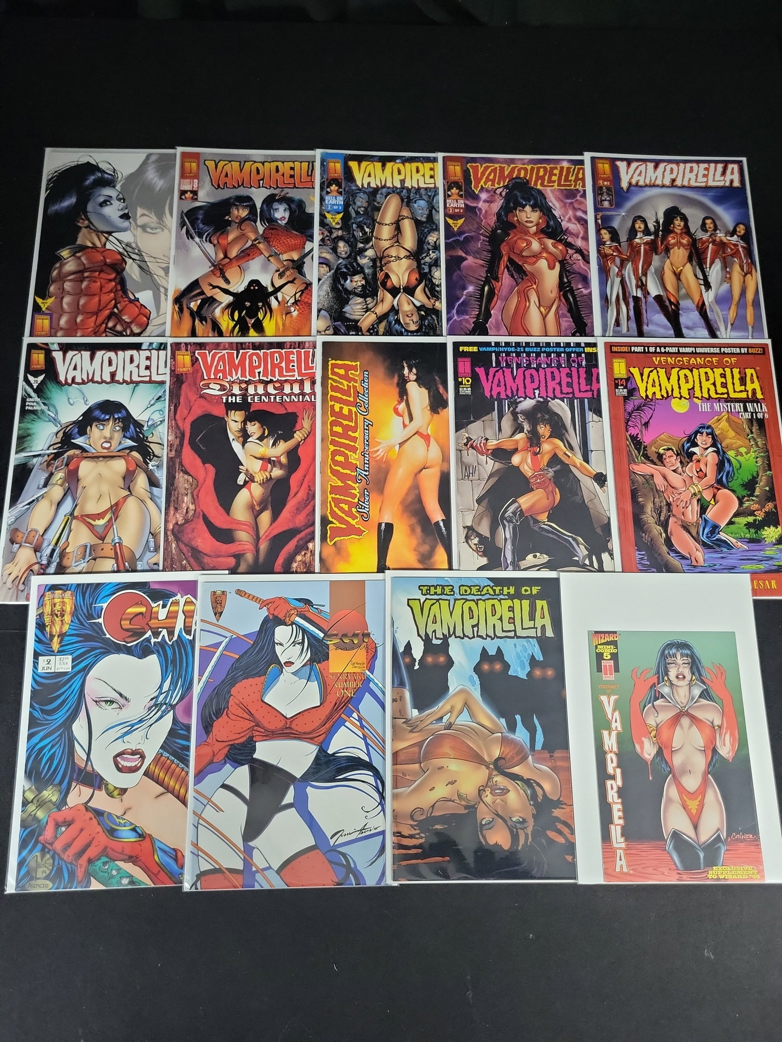 I02128 | A Collection of 15 Modern Age Comic Books Featuring Vampirella and Shi, 1990s: BID PER WHAT YOU SEE IN THE PHOTO, NOT THE AI GENERATED TITLES AND DESCRIPTIONS! A Collection of 15 Modern Age Comic Books Featuring Vampirella and Shi, 1990s This lot comprises 15 Modern Age comic bo
