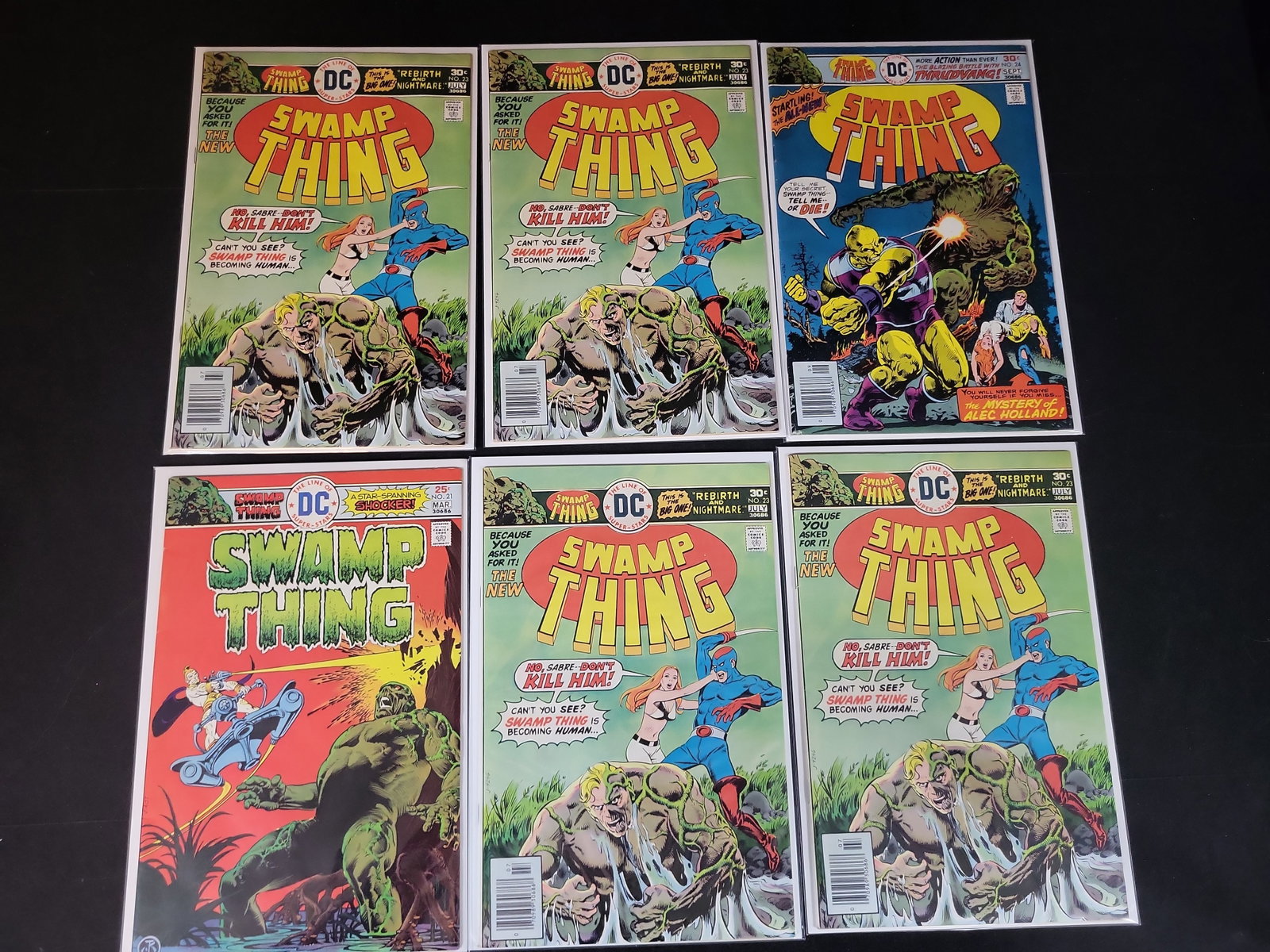 I02180 | A Collection of Six Swamp Thing Vol. 1 Bronze Age Comic Books Including Issues 21, 23, and (1 of 4)