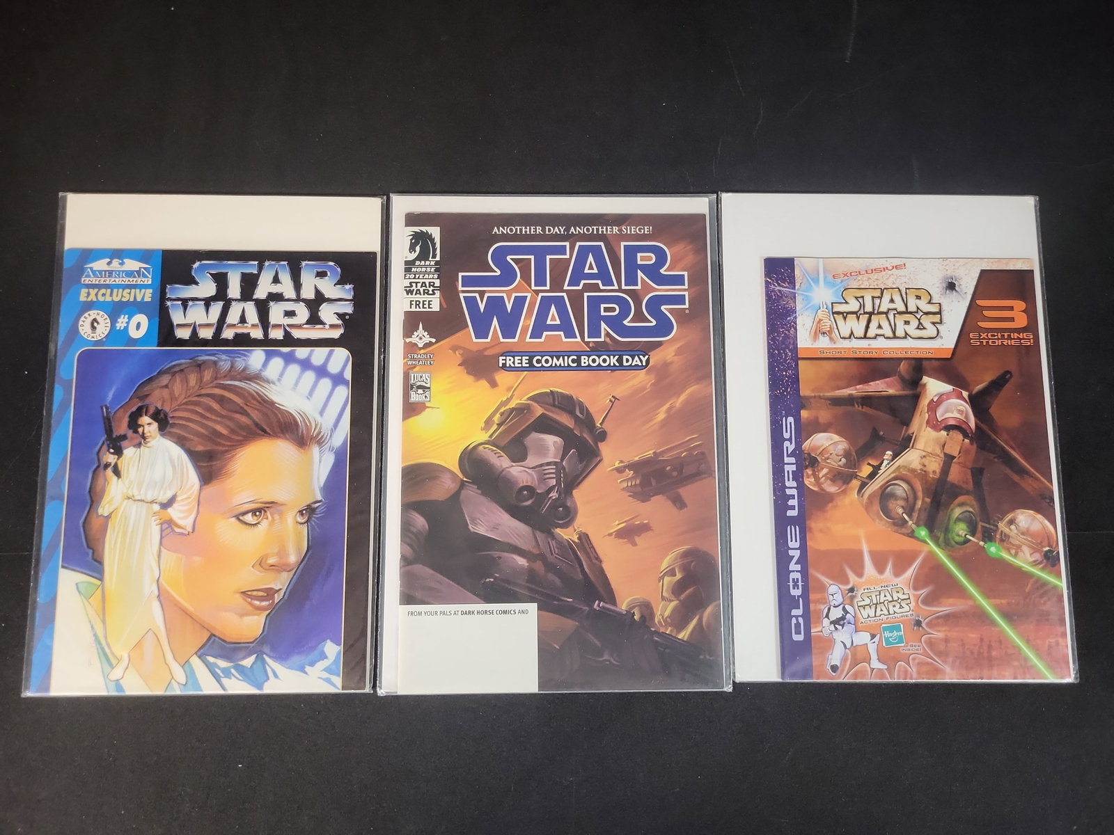 I02485 | Three Star Wars Promotional and Exclusive Comic Books Including American Entertainment: BID PER WHAT YOU SEE IN THE PHOTO, NOT THE AI GENERATED TITLES AND DESCRIPTIONS! Three Star Wars Promotional and Exclusive Comic Books Including American Entertainment Exclusive Issue 0 This lot consi