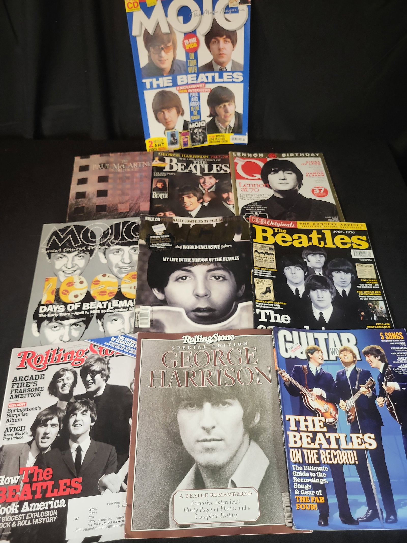 I02578 | A Collection of Beatles-Related Music Magazines and Commemorative Publications. Various,: BID PER WHAT YOU SEE IN THE PHOTO, NOT THE AI GENERATED TITLES AND DESCRIPTIONS! A Collection of Beatles-Related Music Magazines and Commemorative Publications. Various, 1989-2014. This collection con