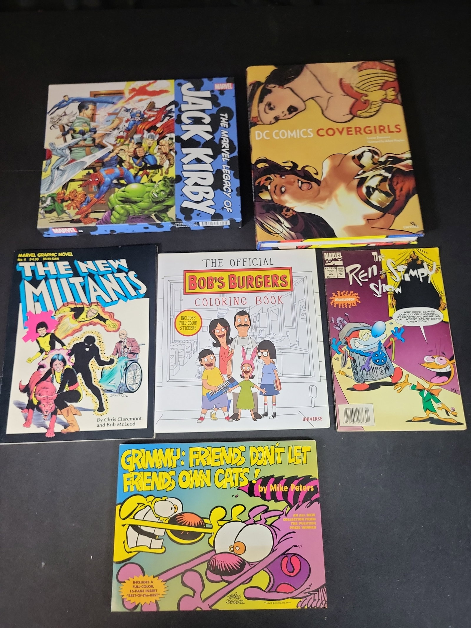 I02820 | A Collection of Comic Art and Animation Books including DC Comics Covergirls and Jack: BID PER WHAT YOU SEE IN THE PHOTO, NOT THE AI GENERATED TITLES AND DESCRIPTIONS! A Collection of Comic Art and Animation Books including DC Comics Covergirls and Jack Kirby. This collection encompasse