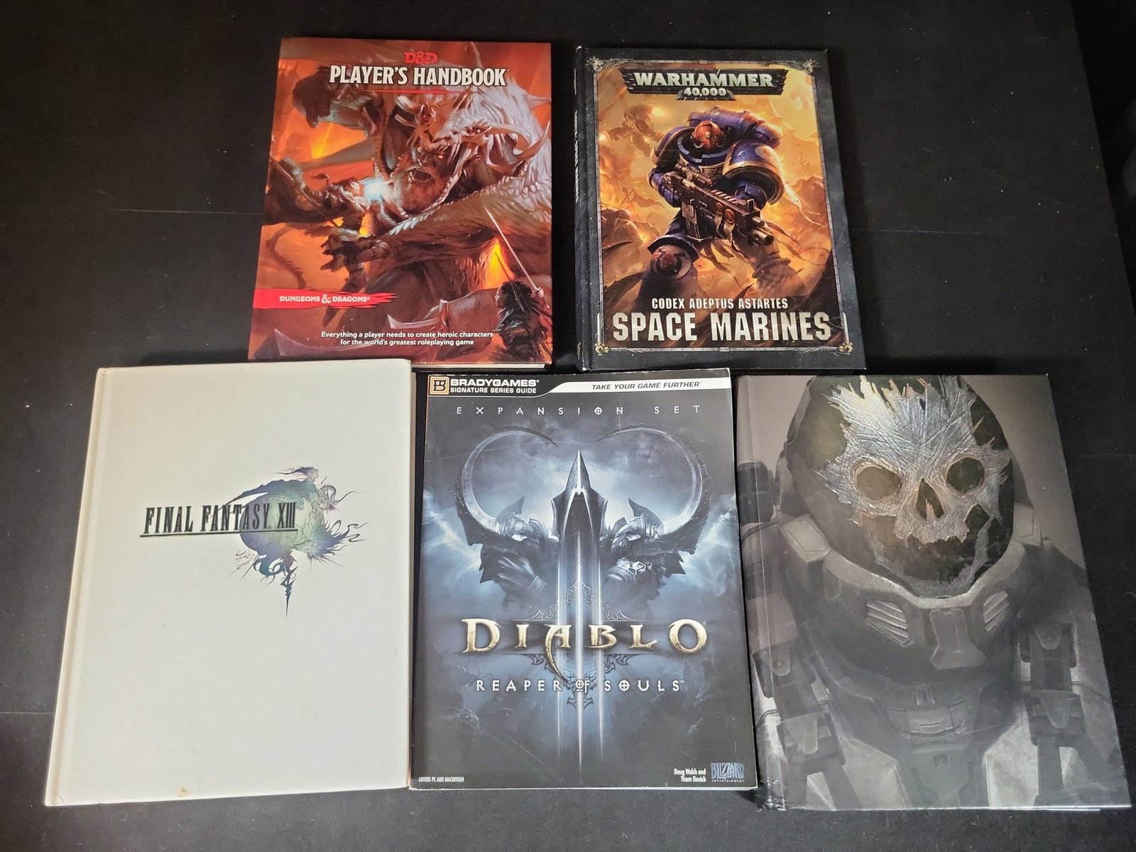 I02905 | An Assortment of Tabletop Gaming Rulebooks and Video Game Strategy Guides (1 of 11)