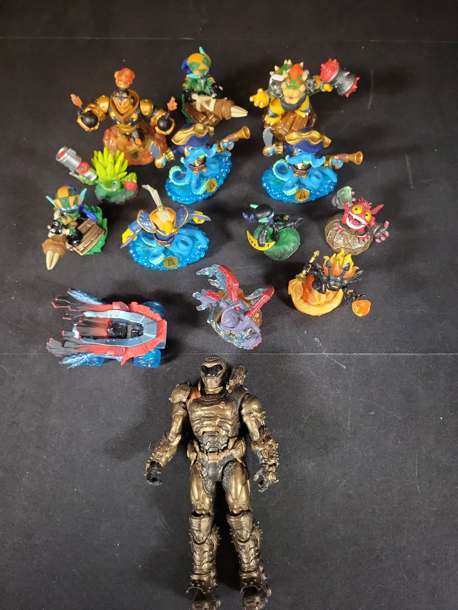 I02989 | A Collection of Skylanders Video Game Figures and Vehicle with a McFarlane Toys DOOM Slayer (1 of 6)
