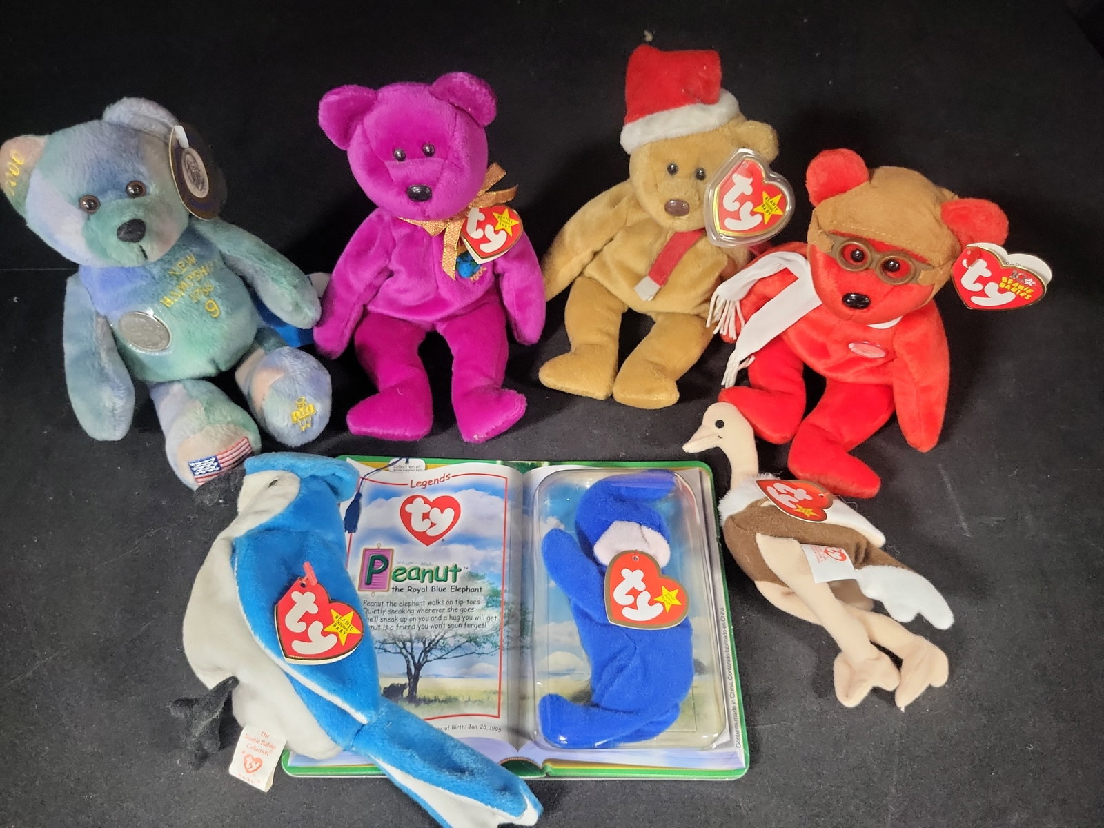 I02794 | A Collection of Seven Ty Beanie Babies Plush Toys Including Peanut the Royal Blue Elephant: BID PER WHAT YOU SEE IN THE PHOTO, NOT THE AI GENERATED TITLES AND DESCRIPTIONS! A Collection of Seven Ty Beanie Babies Plush Toys Including Peanut the Royal Blue Elephant Legends Set This lot consist