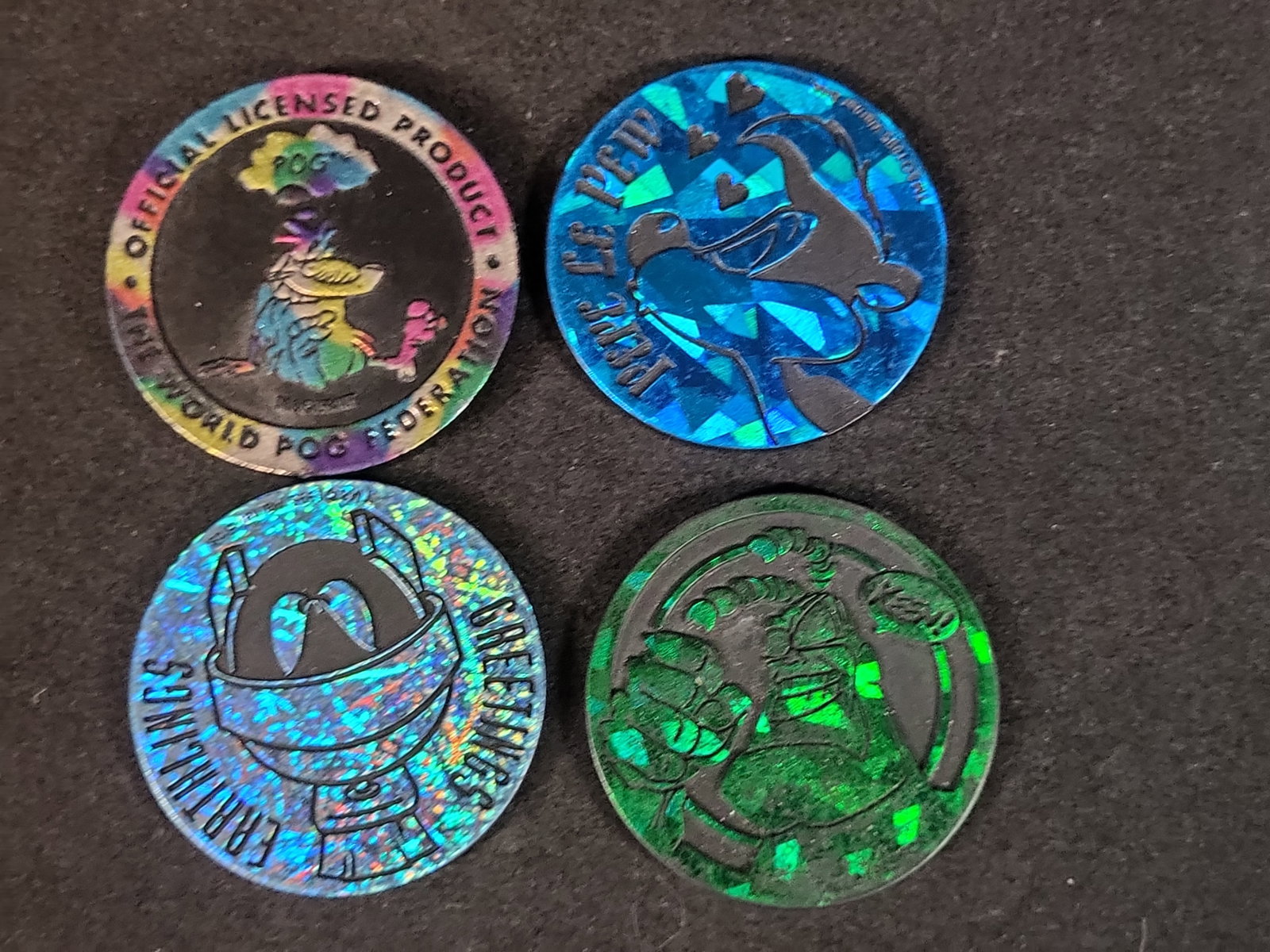 I02926 | A Collection of Four Vintage World POG Federation and Licensed Character Slammers (1 of 7)