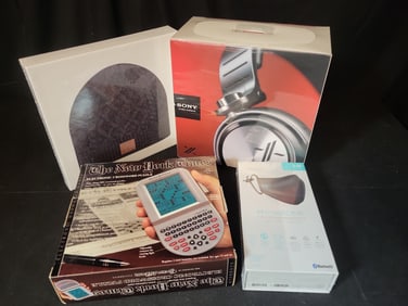 I02906 | A Collection of Four Electronic Gadgets and Accessories Including Sony MDR-X10 Headphones
