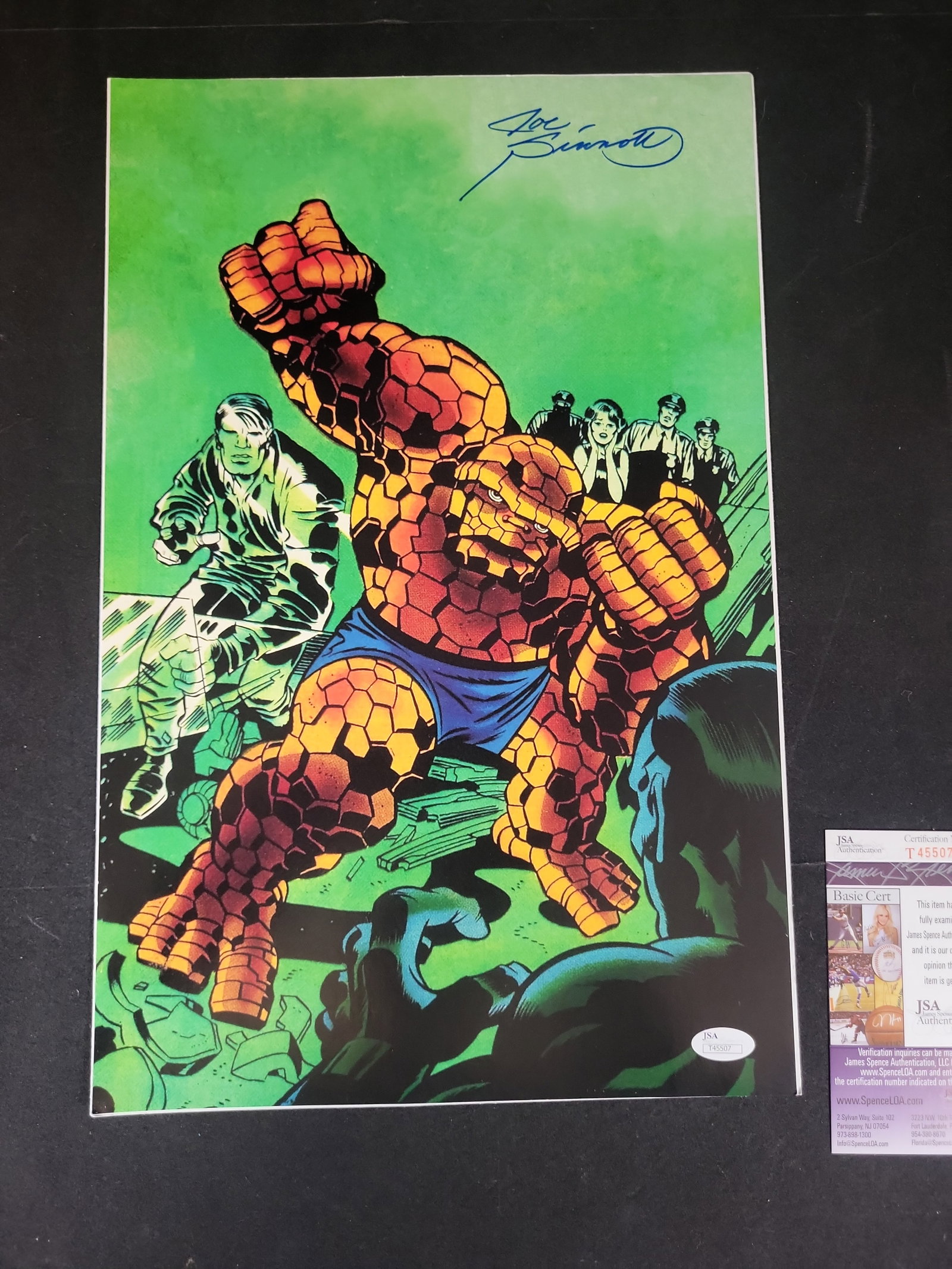 I02871 | Joe Sinnott Signed Marvel Fantastic Four The Thing Art Print with JSA Authentication: BID PER WHAT YOU SEE IN THE PHOTO, NOT THE AI GENERATED TITLES AND DESCRIPTIONS! Joe Sinnott Signed Marvel Fantastic Four The Thing Art Print with JSA Authentication This lot features a vertical color