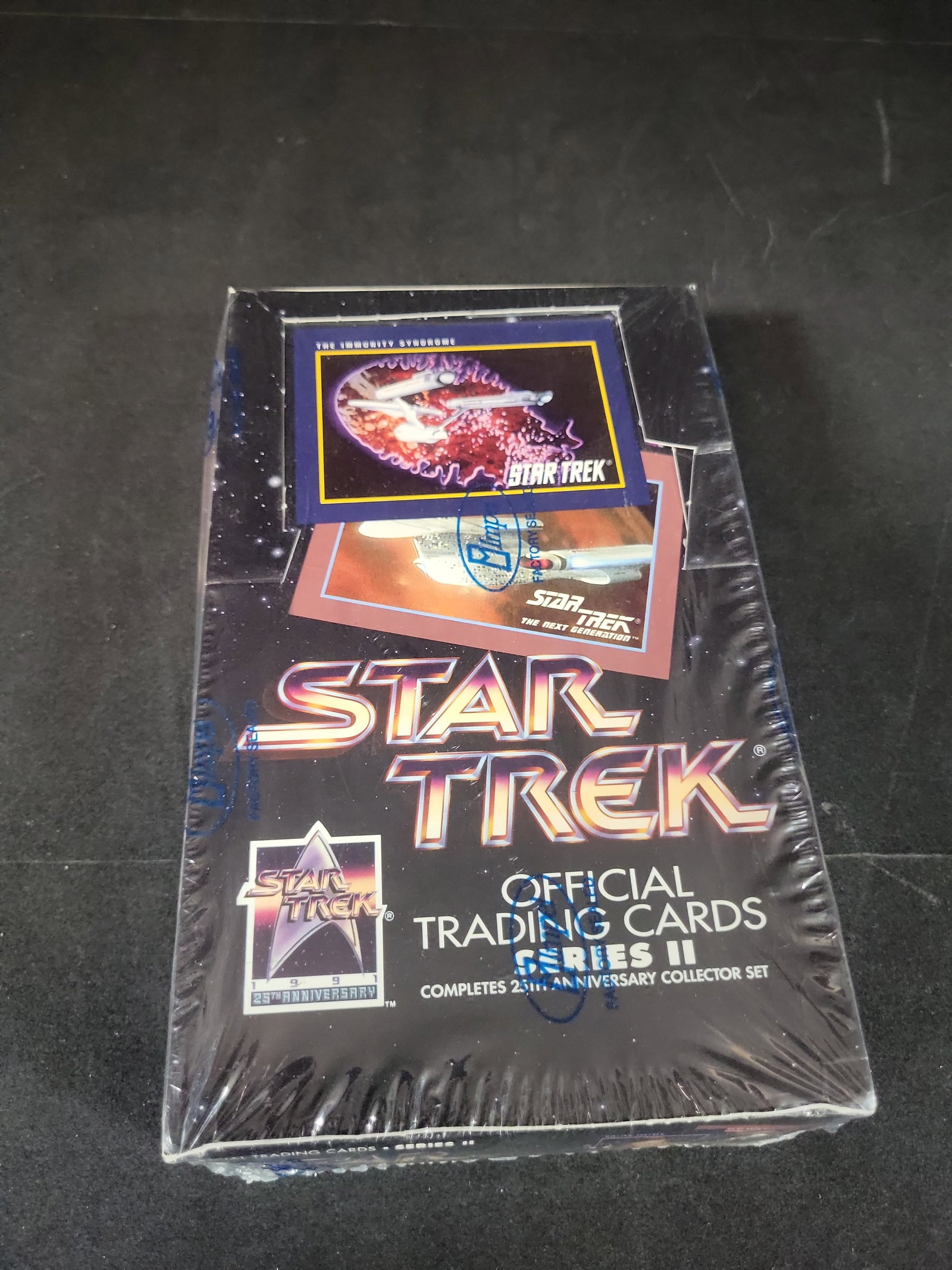 I02561 | 1991 Impel Star Trek Official Trading Cards Series II Factory Sealed Box: BID PER WHAT YOU SEE IN THE PHOTO, NOT THE AI GENERATED TITLES AND DESCRIPTIONS! 1991 Impel Star Trek Official Trading Cards Series II Factory Sealed Box This is a 1991 factory-sealed box of Star Trek