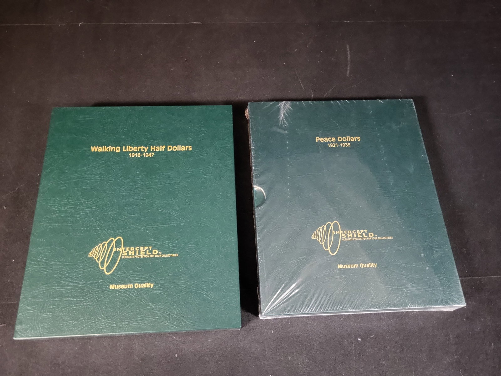 I02955 | A Pair of Intercept Shield Museum Quality US Walking Liberty and Peace Dollar Coin Albums (1 of 2)