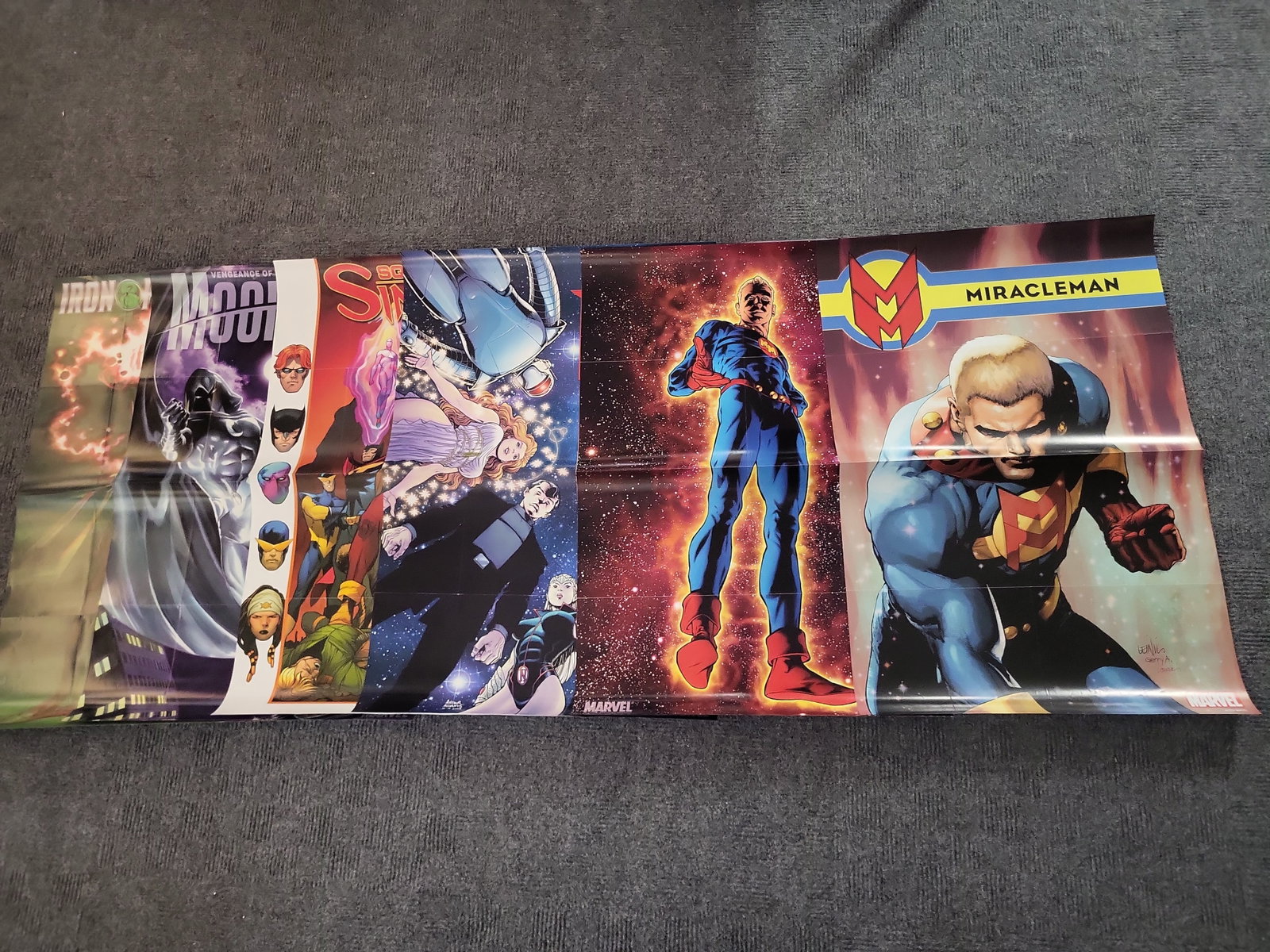 I02994 | A Collection of Seven Marvel Comics Retailer Promotional Posters: BID PER WHAT YOU SEE IN THE PHOTO, NOT THE AI GENERATED TITLES AND DESCRIPTIONS! A Collection of Seven Marvel Comics Retailer Promotional Posters This lot consists of a collection of seven original Ma