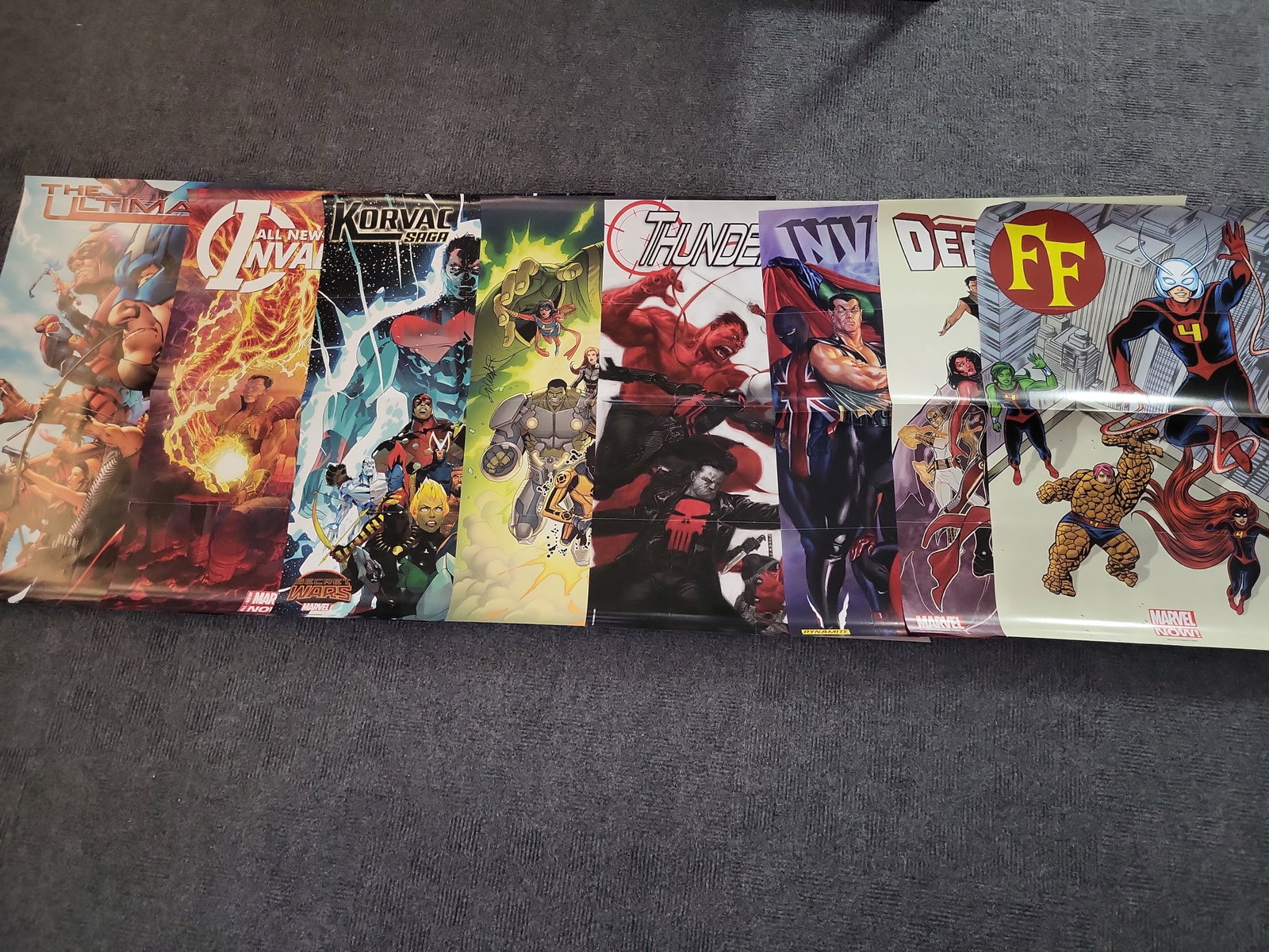 I02996 | A Collection of 8 Marvel Comics Promotional Posters c. 2004-2015: BID PER WHAT YOU SEE IN THE PHOTO, NOT THE AI GENERATED TITLES AND DESCRIPTIONS! A Collection of 8 Marvel Comics Promotional Posters c. 2004-2015 A collection of eight single-sided promotional comic b