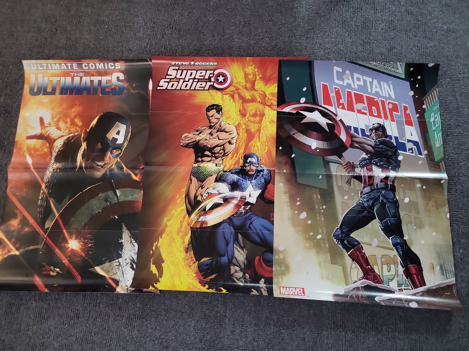 I02999 | Lot of Four Marvel Comics Captain America Promotional Posters: BID PER WHAT YOU SEE IN THE PHOTO, NOT THE AI GENERATED TITLES AND DESCRIPTIONS! Lot of Four Marvel Comics Captain America Promotional Posters An assortment of four original promotional comic book pos