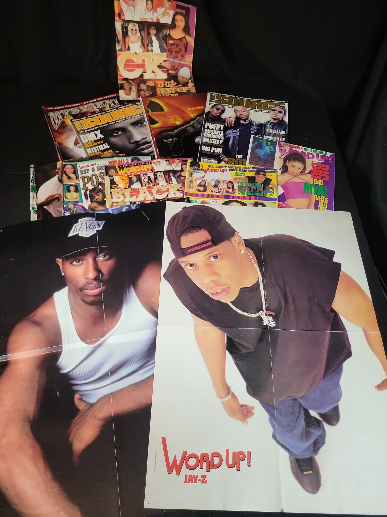 I02932 | A Collection of Vintage Hip-Hop and R&B Magazines and Foldable Posters: BID PER WHAT YOU SEE IN THE PHOTO, NOT THE AI GENERATED TITLES AND DESCRIPTIONS! A Collection of Vintage Hip-Hop and R&B Magazines and Foldable Posters This lot consists of a collection of vintage
