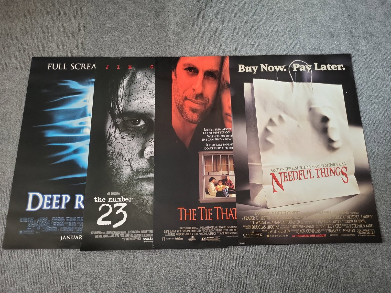 I02852 | Four Original Theatrical Movie Posters Including Needful Things and Deep Rising: BID PER WHAT YOU SEE IN THE PHOTO, NOT THE AI GENERATED TITLES AND DESCRIPTIONS! Four Original Theatrical Movie Posters Including Needful Things and Deep Rising This lot consists of four original thea