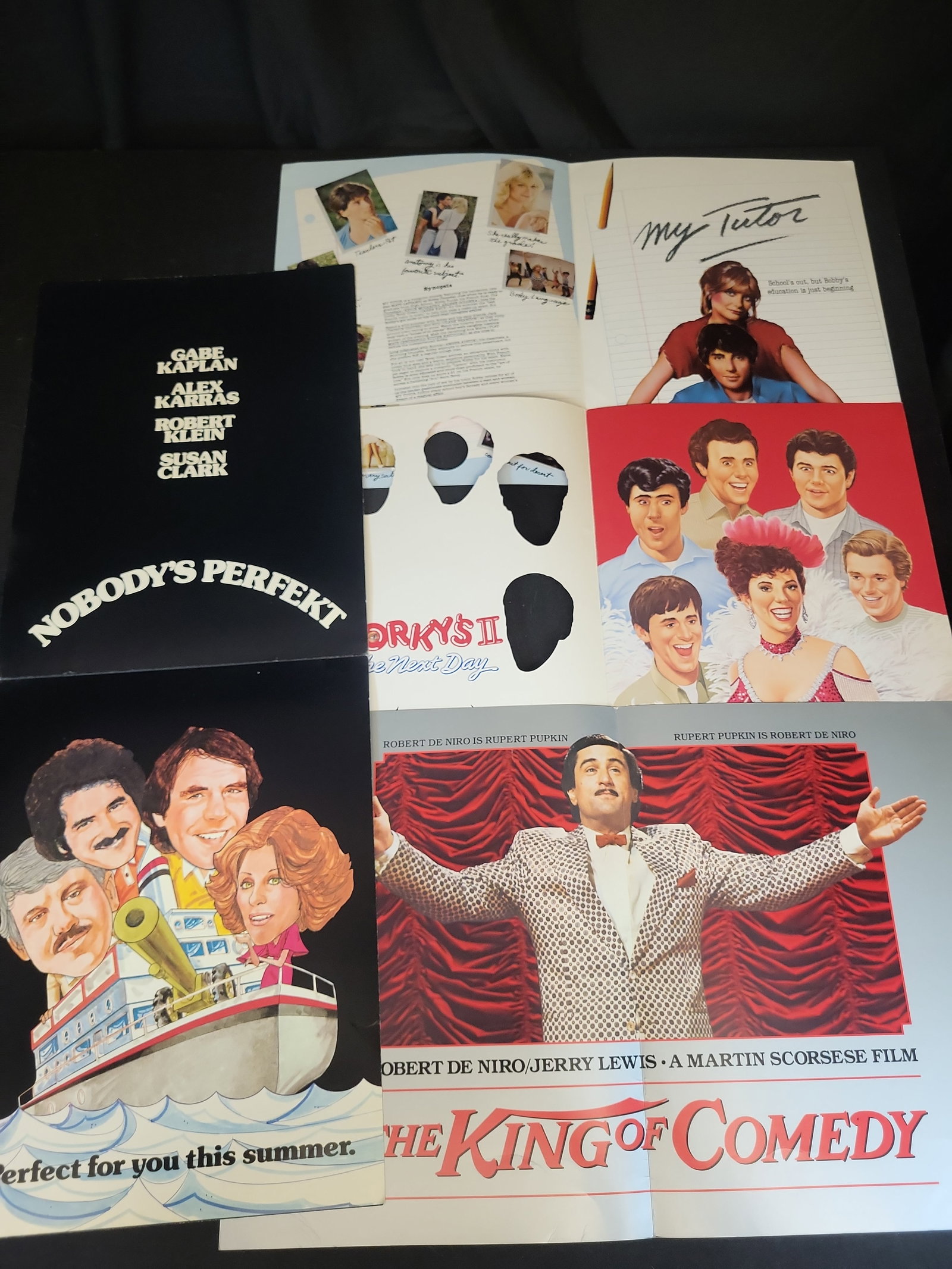 I03460 | Group of Four Vintage 1980s Movie Pressbooks and Promotional Press Folders: BID PER WHAT YOU SEE IN THE PHOTO, NOT THE AI GENERATED TITLES AND DESCRIPTIONS! This lot consists of a group of four original, vintage theatrical pressbooks and promotional press folders from the ear